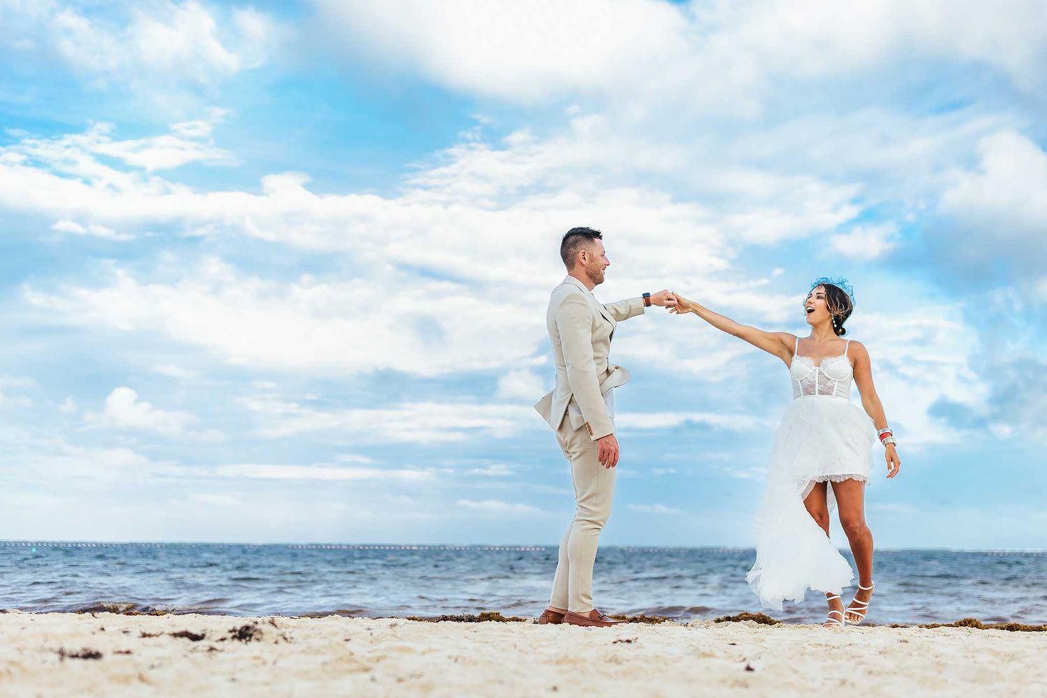 Playful beach engagement photography session in Puerto Morelos Mexico