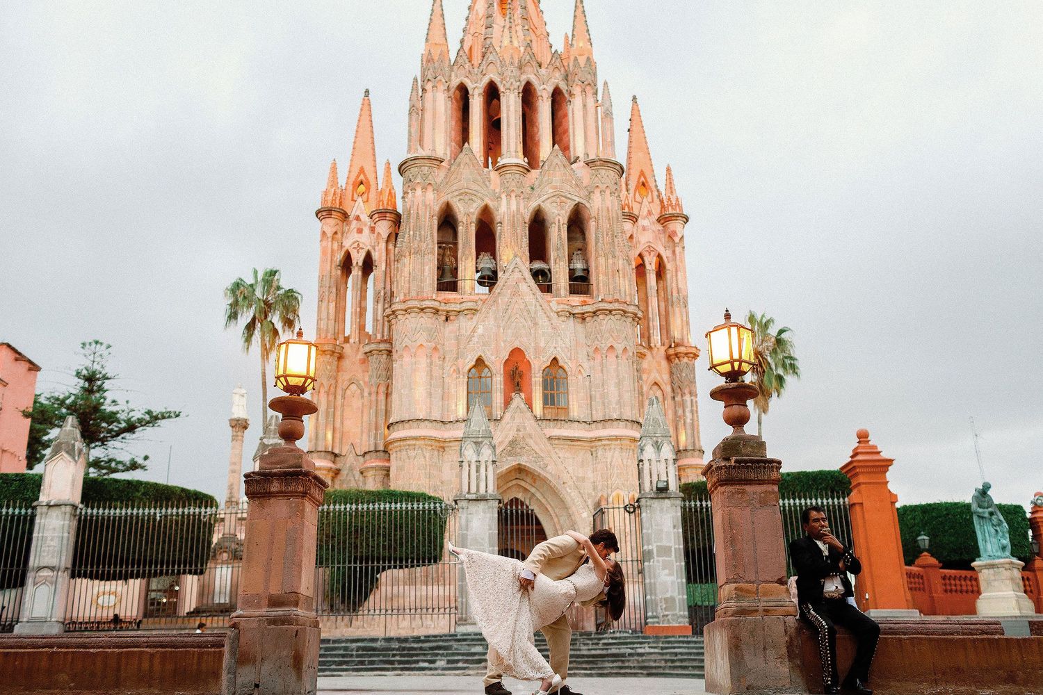 Bride and groom portrait in front of Parroquia de San Miguel Arcángel by Luckie Photography.