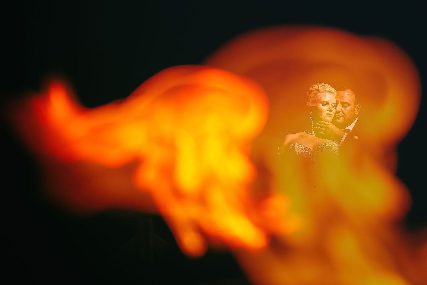 Gwen and Ramon in a creative night wedding portrait at Hyatt Ziva Cancun by Luckie Photography