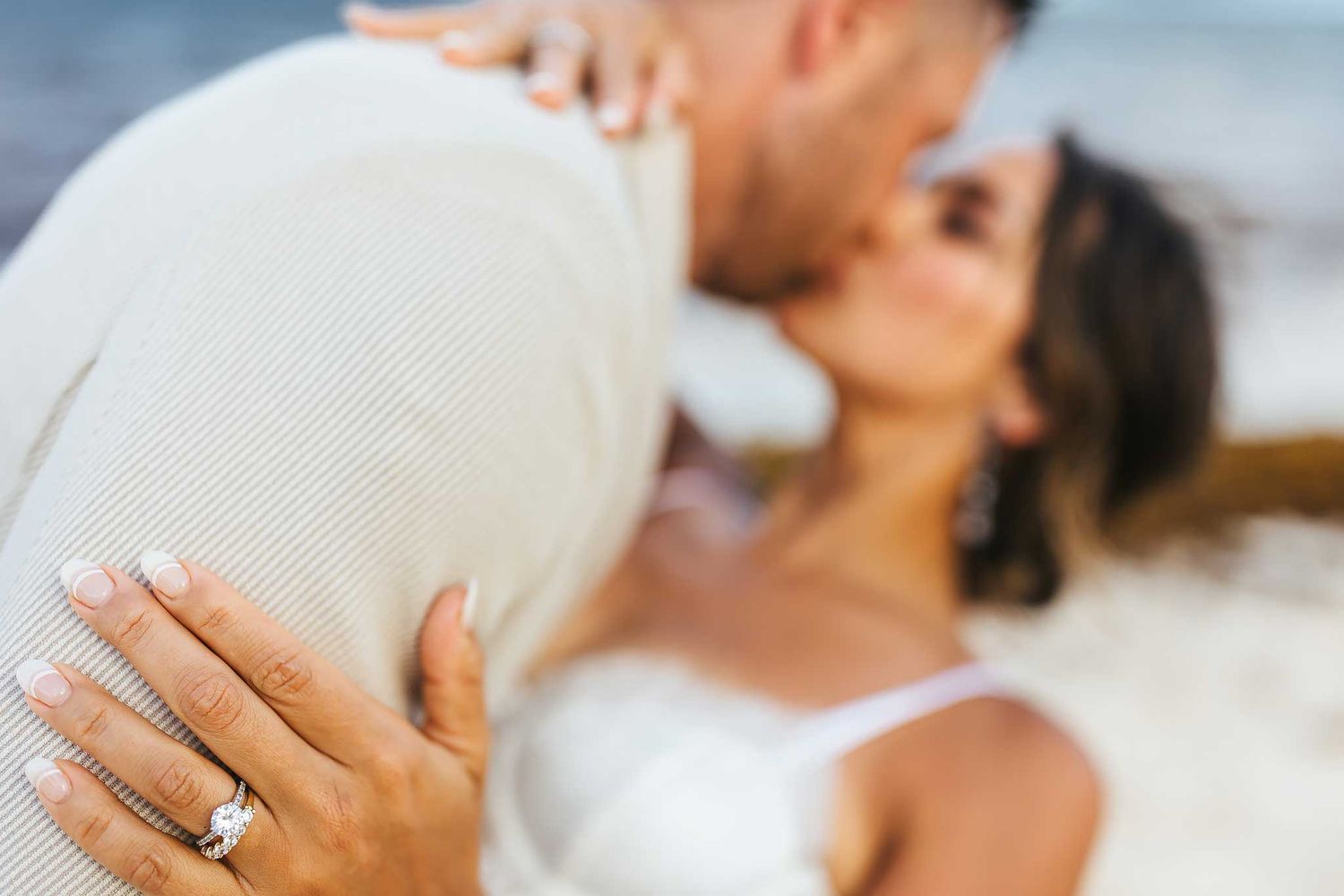 Closeup engagement ring photo during beach couples session in Cancun