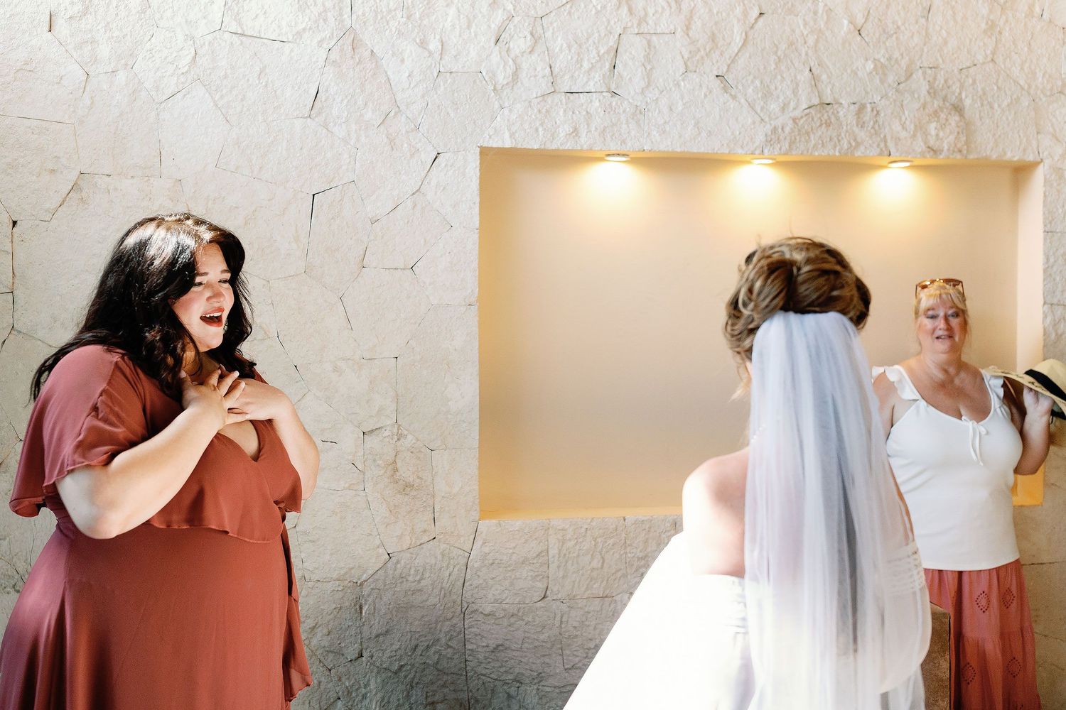 A loved one reacts emotionally as she sees Nicole wearing her wedding dress and veil before the Blue Venado ceremony in Playa del Carmen.