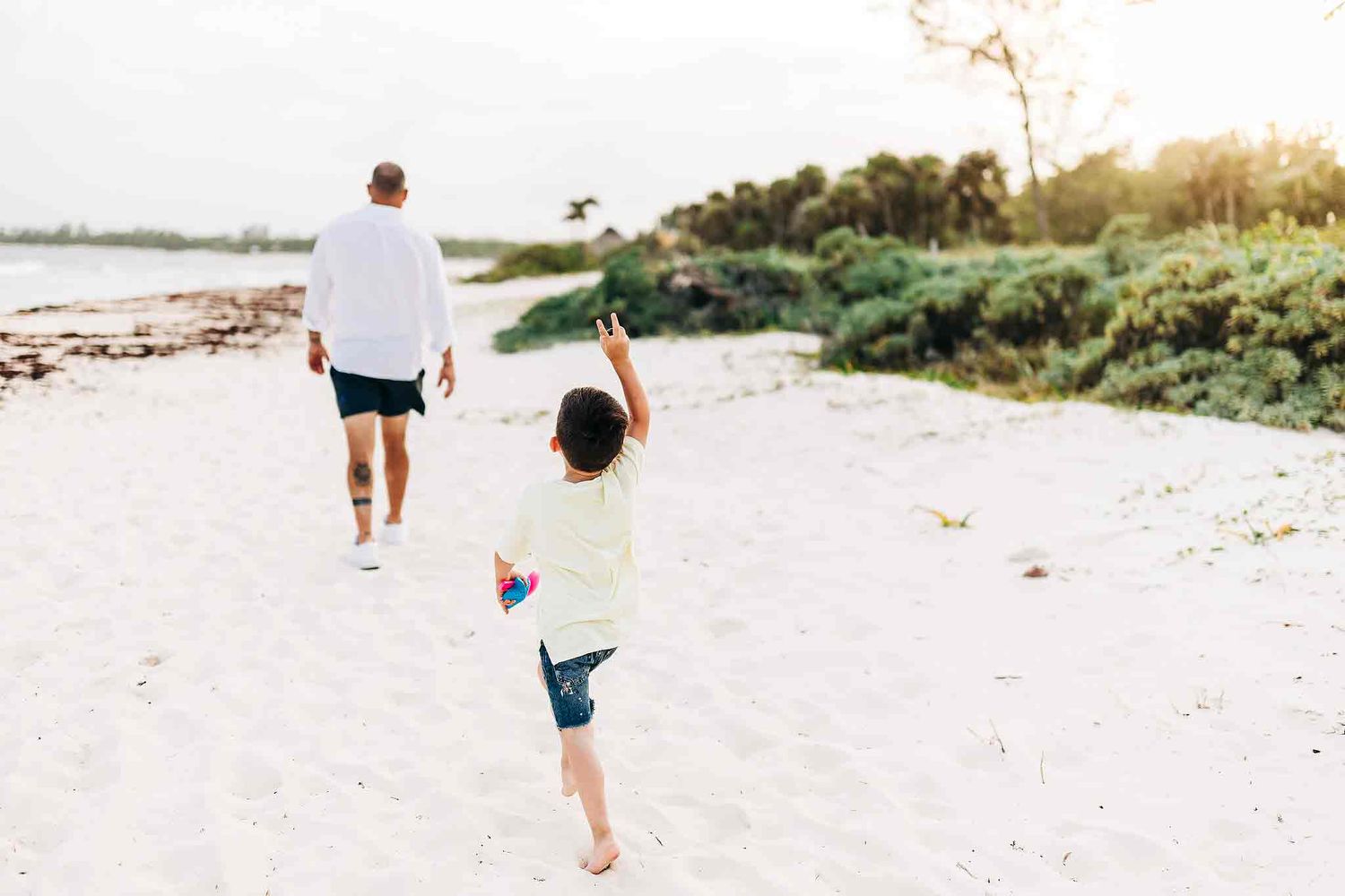 Child walking on the beach during sunset family photography session in Playa del Carmen
