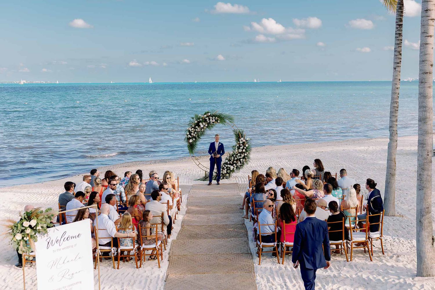 Oceanfront wedding ceremony at Garza Blanca Resort Cancun. Professional destination photography services in the Mexican Caribbean.