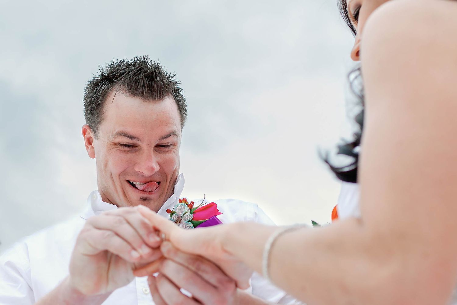 Emotional ring exchange ceremony at Moon Palace Cancun. Professional destination wedding photographer capturing candid moments