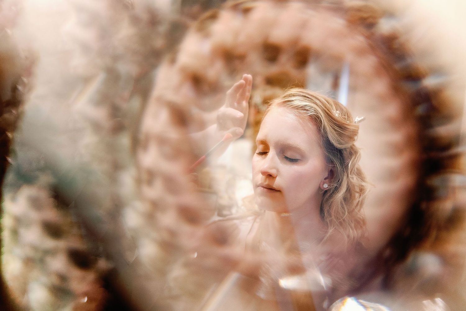 Autumn having her makeup applied while preparing for her Dreams Sapphire wedding in Puerto Morelos.
