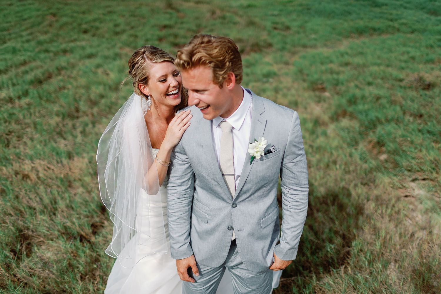 Katie and Robert smiling during wedding portraits at Barceló Riviera Maya by Luckie Photography.