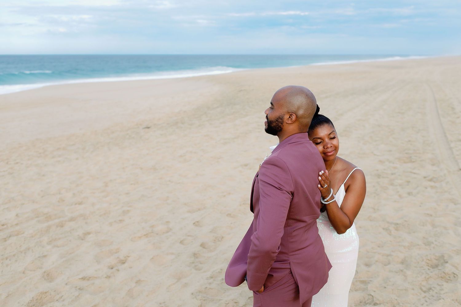 Romantic beach portrait of a newlywed couple at Hard Rock Los Cabos, showcasing the natural beauty and luxury of a Los Cabos destination wed