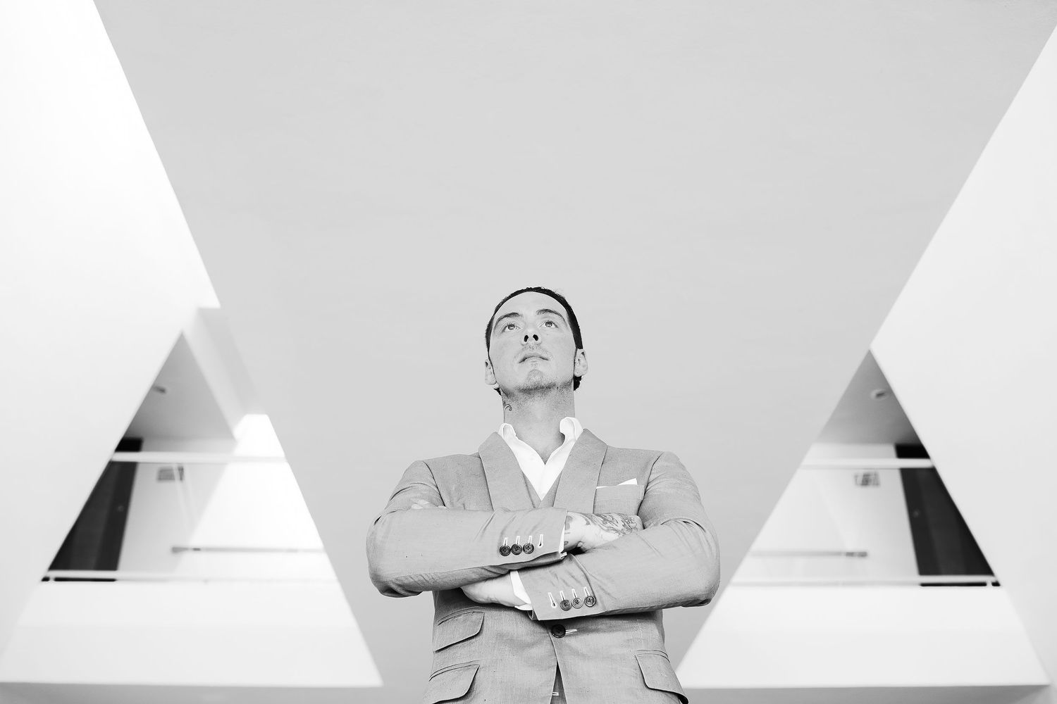 Black-and-white portrait of Scott in his wedding suit at the resort