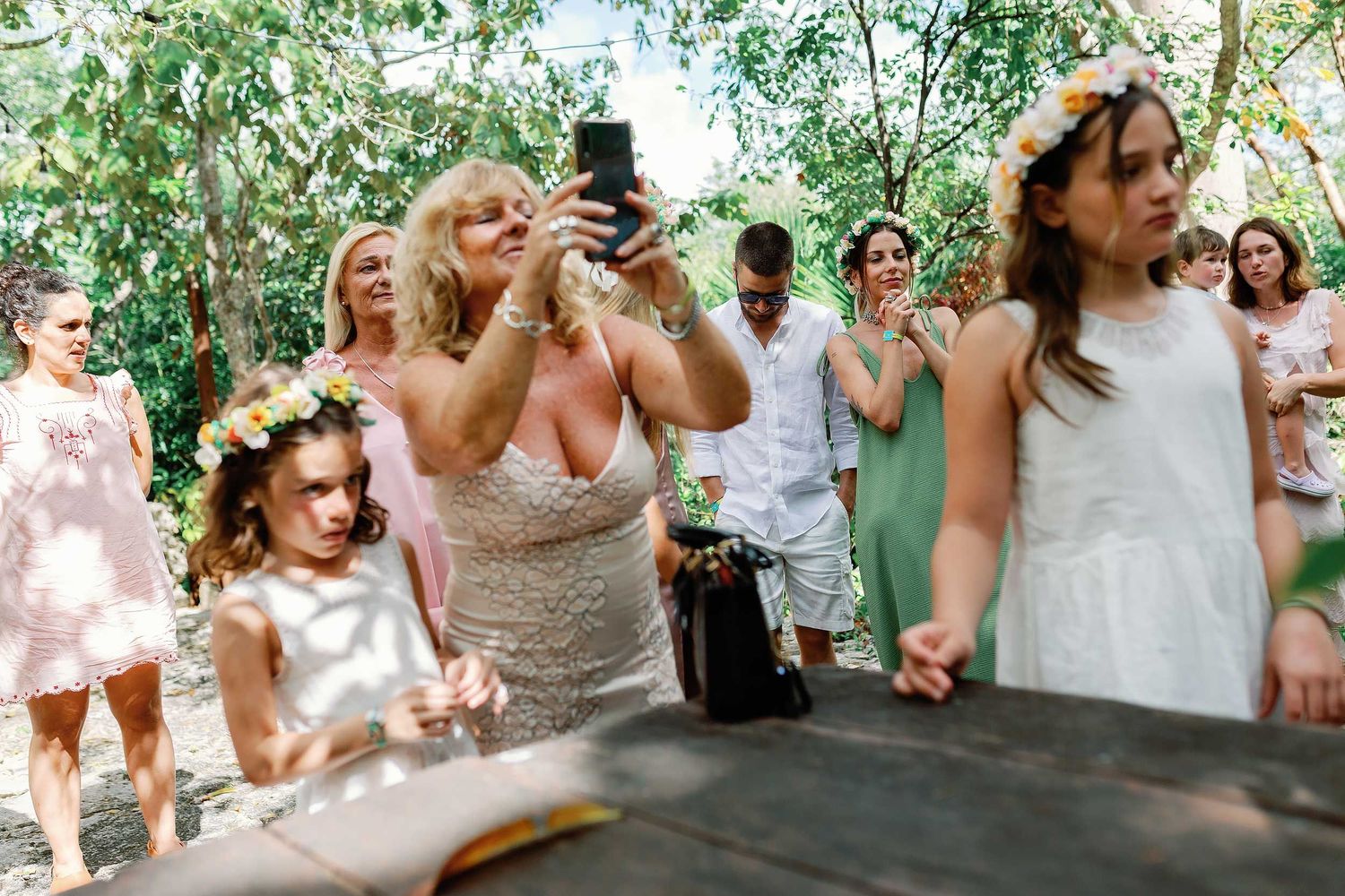 Guests gathering in the tropical jungle before an intimate civil wedding ceremony at Cenote Hats’uts near Playa del Carmen.