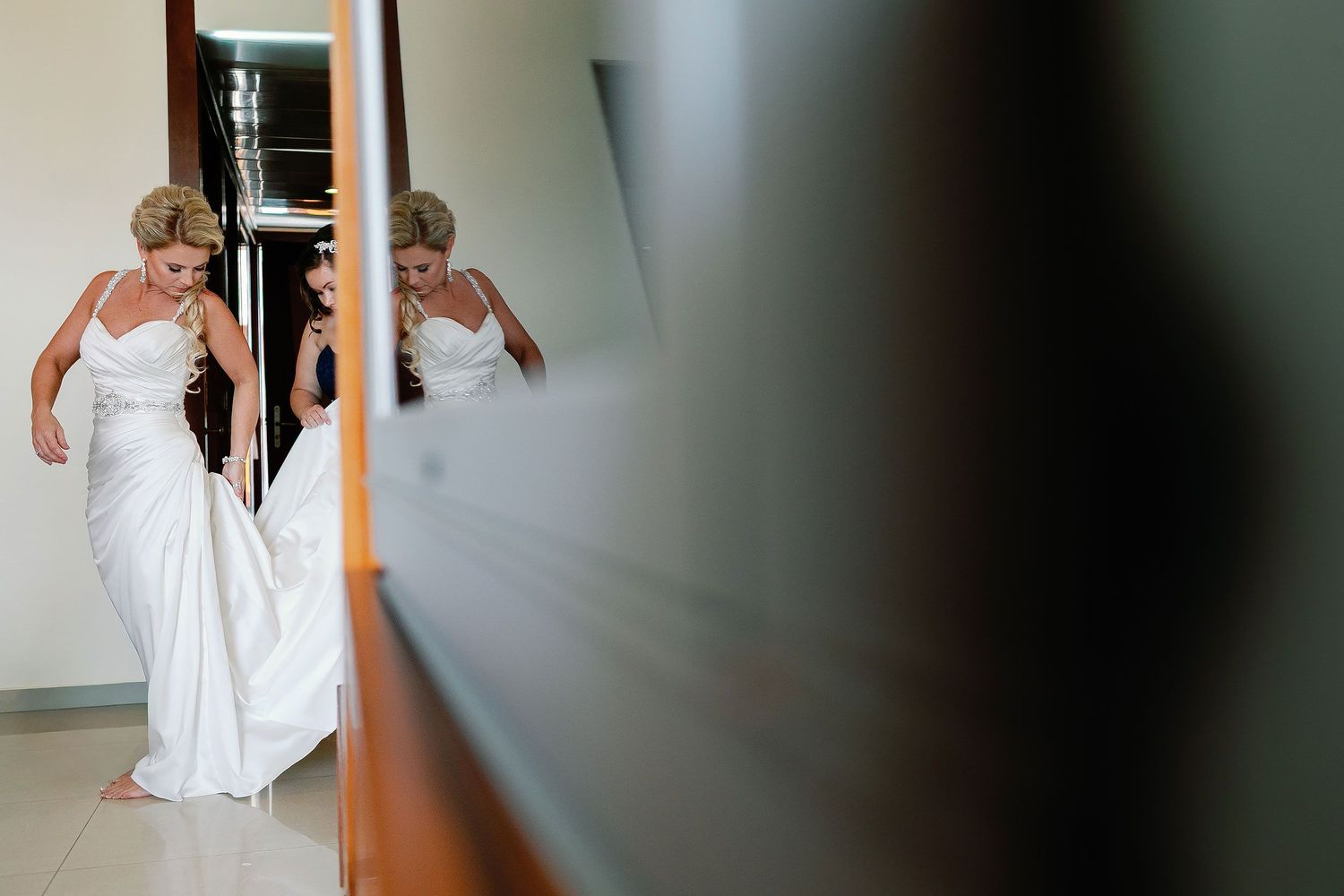 Carly putting on her wedding dress inside the Grand Sirenis resort
