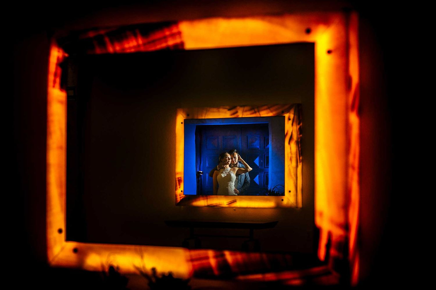 Creative wedding portrait at Atelier Playa Mujeres with artistic framing and dramatic lighting in Riviera Maya Mexico.