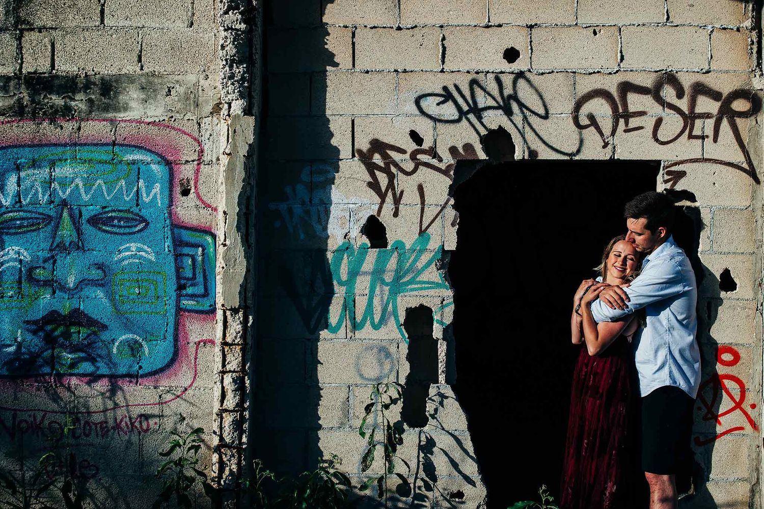 Creative engagement photography beside colorful urban textures near Punta Esmeralda in Playa del Carmen.