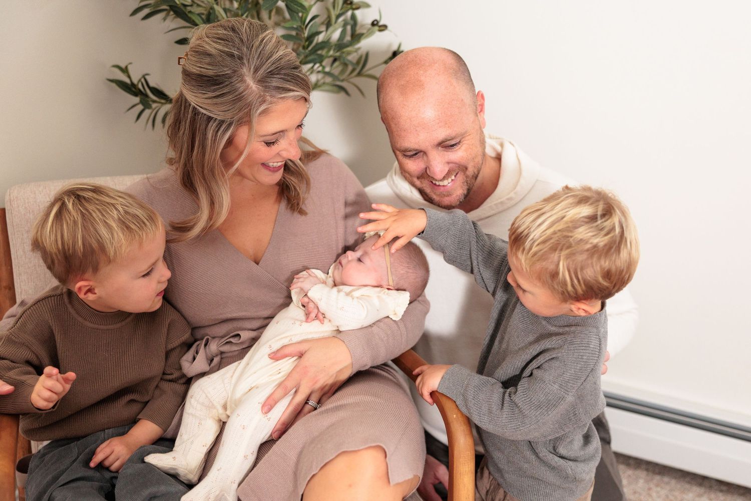 A series of candid family moments showing parents and children laughing and embracing together on a white background.