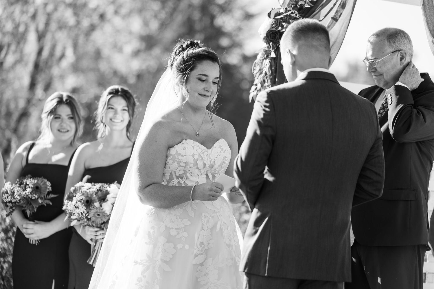 A series of candid black and white wedding ceremony moments captured in sequence.