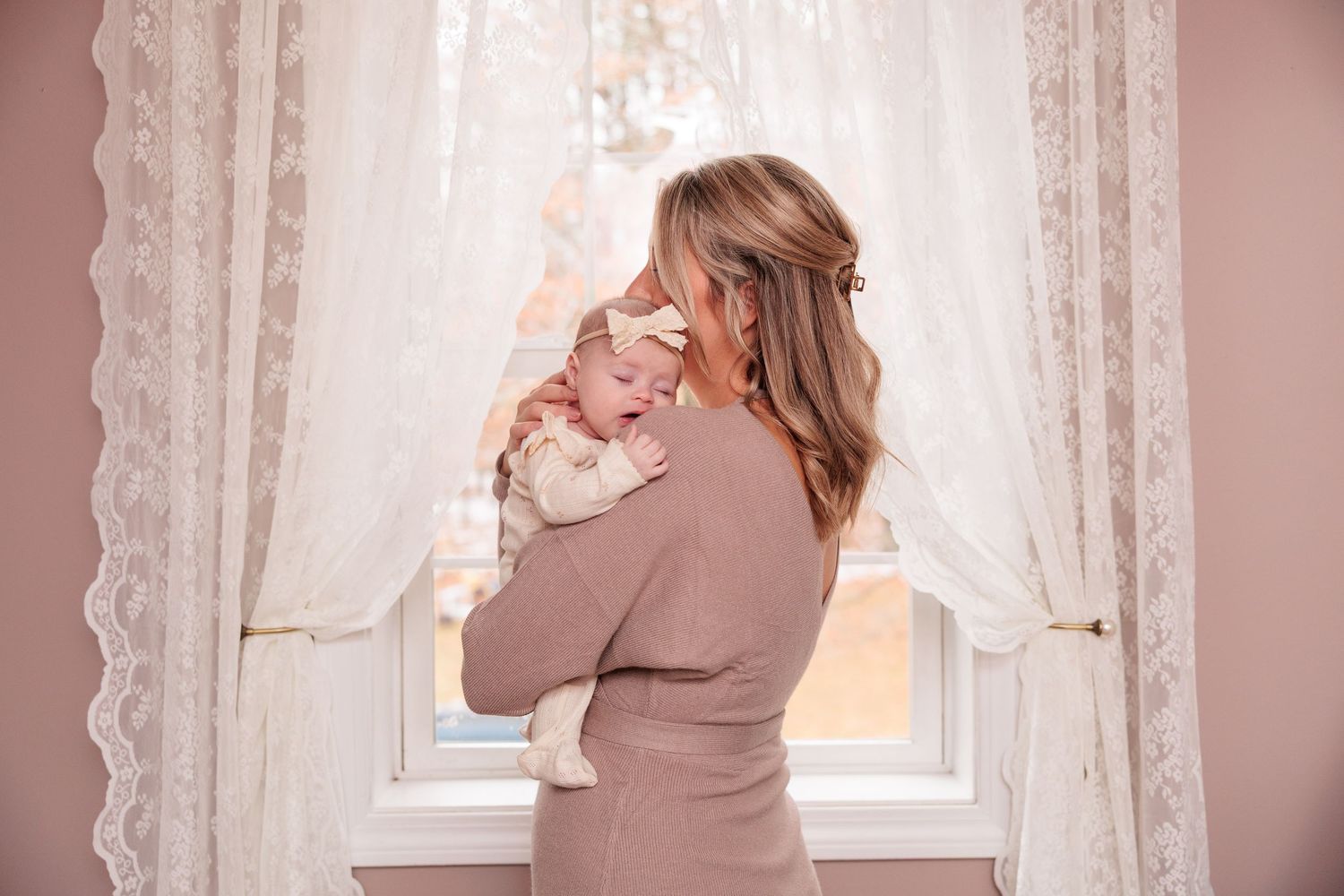 Series of photos showing family members by a window with lace curtains in a nursery.