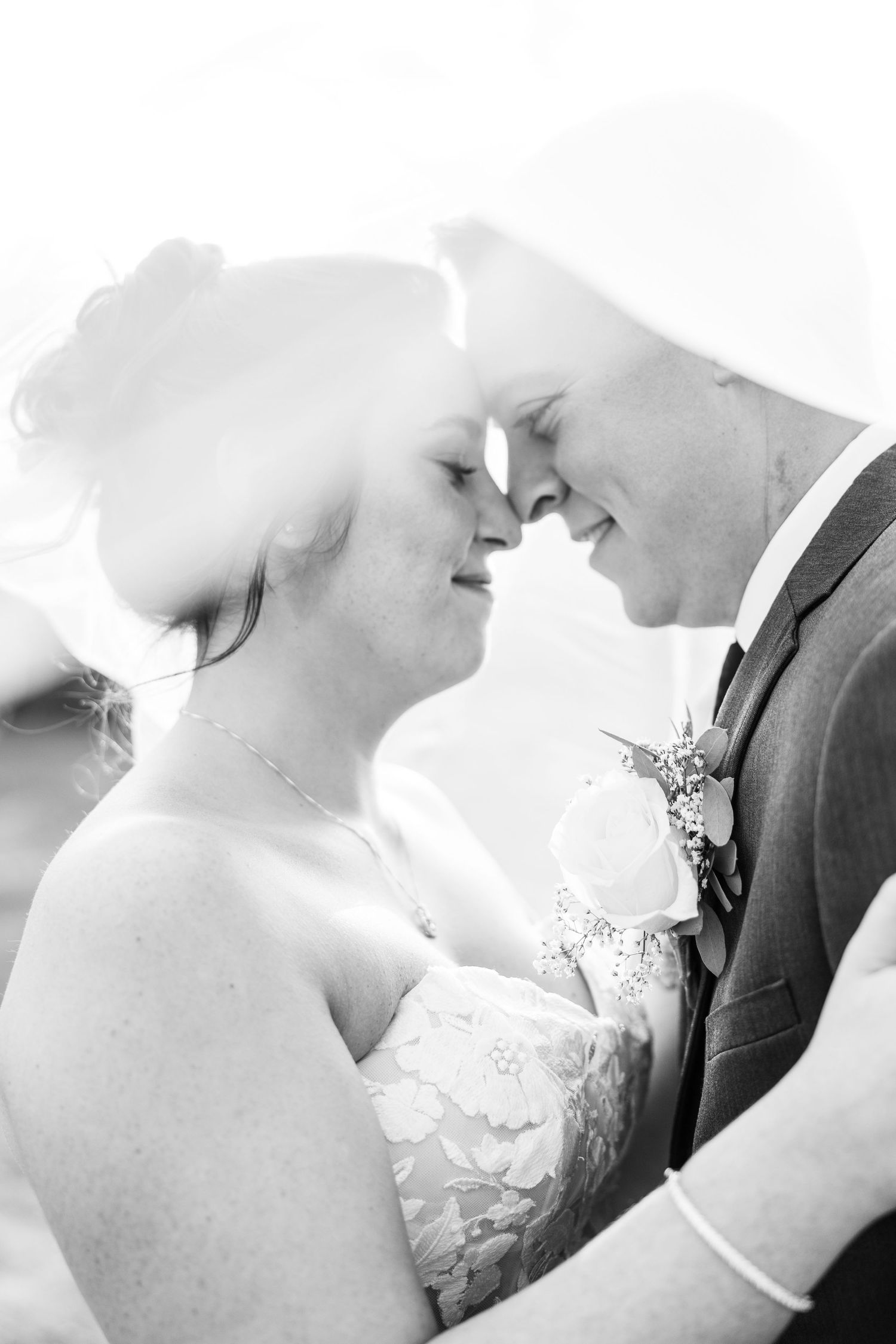 Artistic black and white close-up shots of a romantic wedding moment.