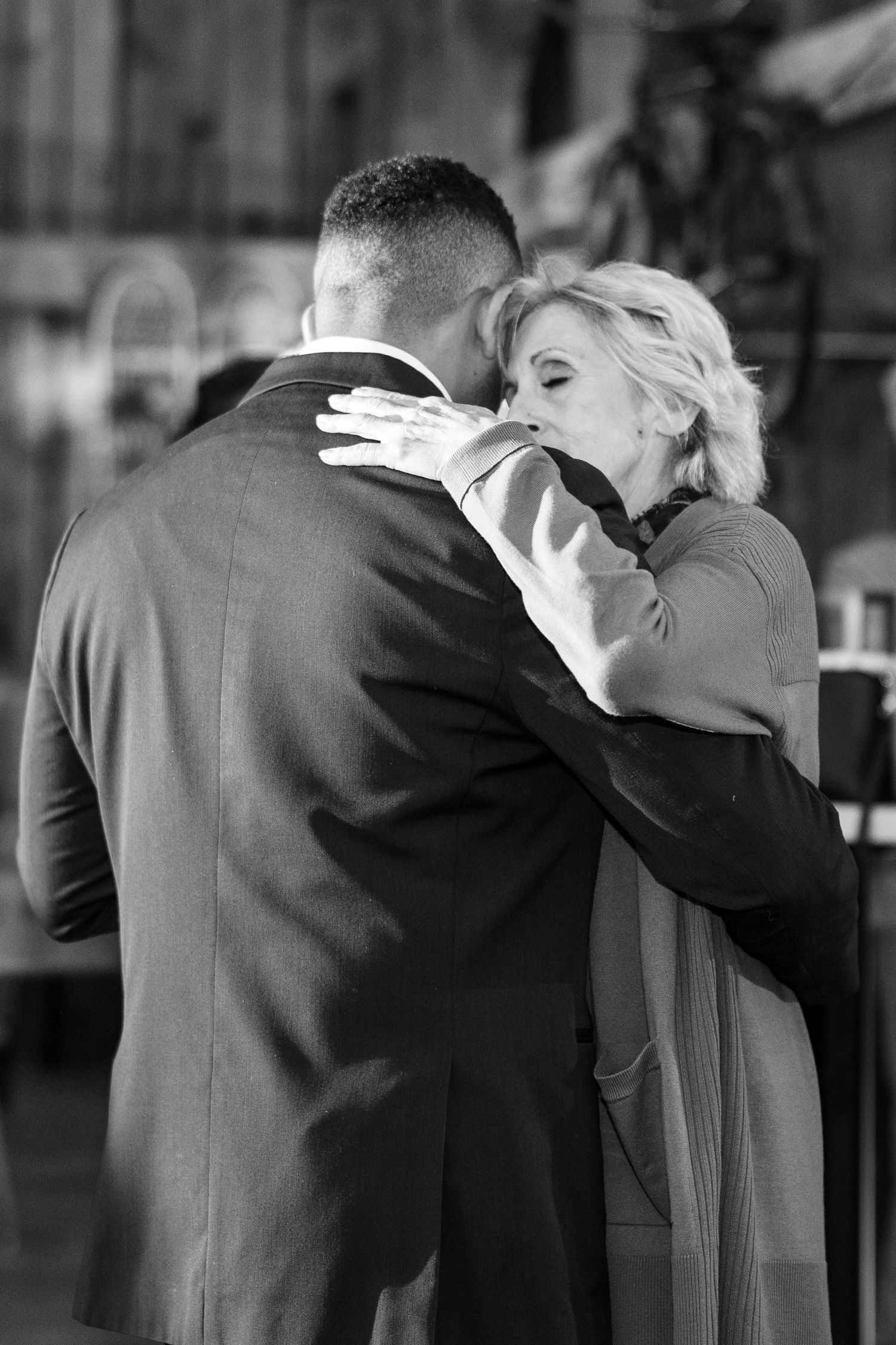 A black and white photo shows couples dancing at an elegant event.