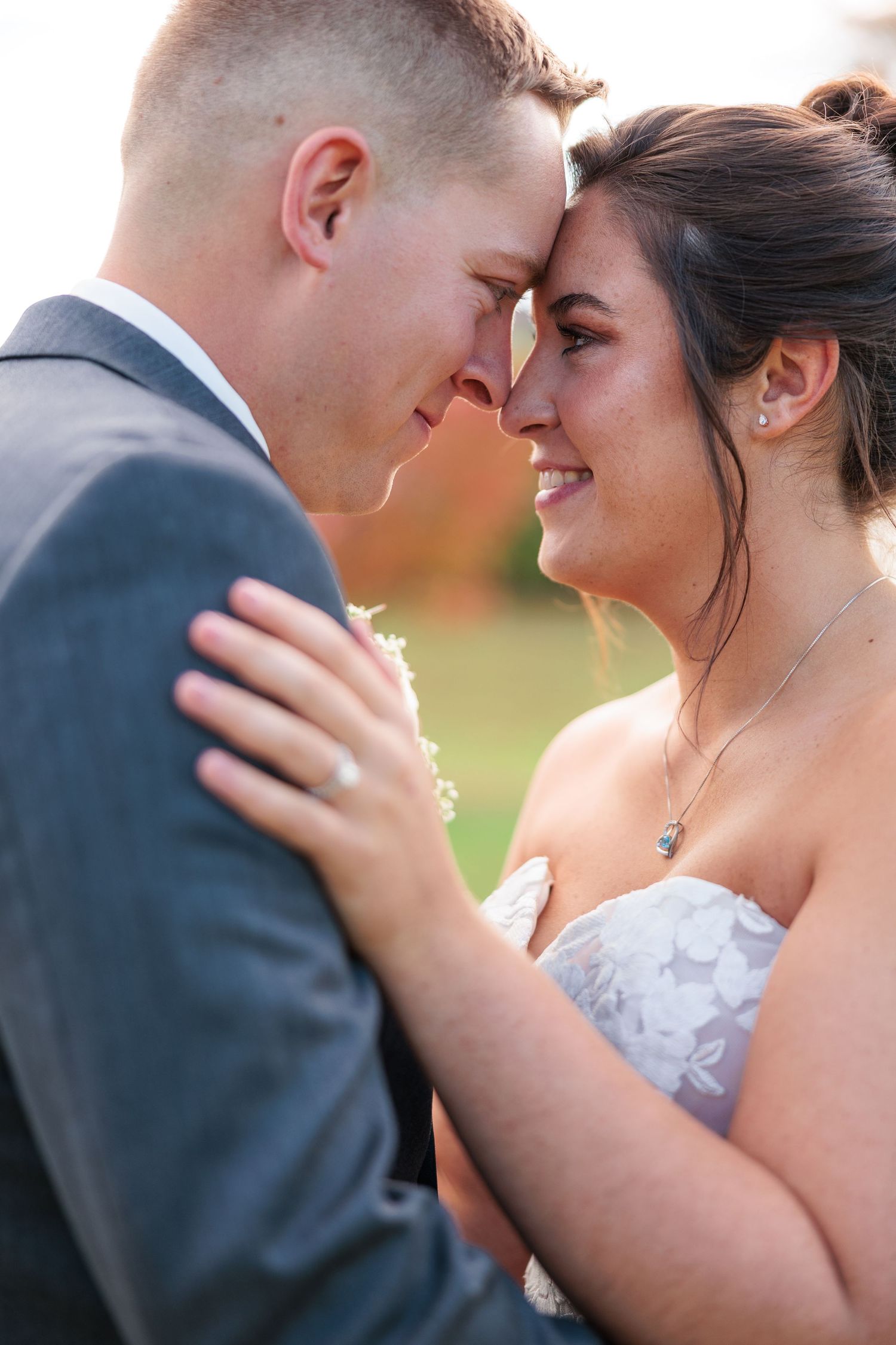A romantic wedding couple shares intimate moments in a series of close-up photos showing their tender expressions.