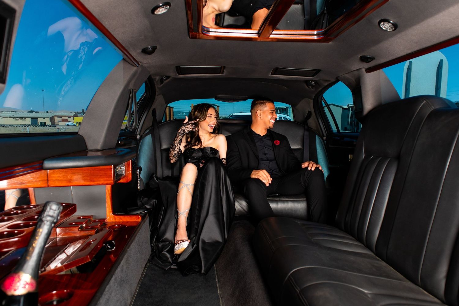 Walvis Bay matric photoshoot of couple cozy in a Limousine driving to the red carpet.