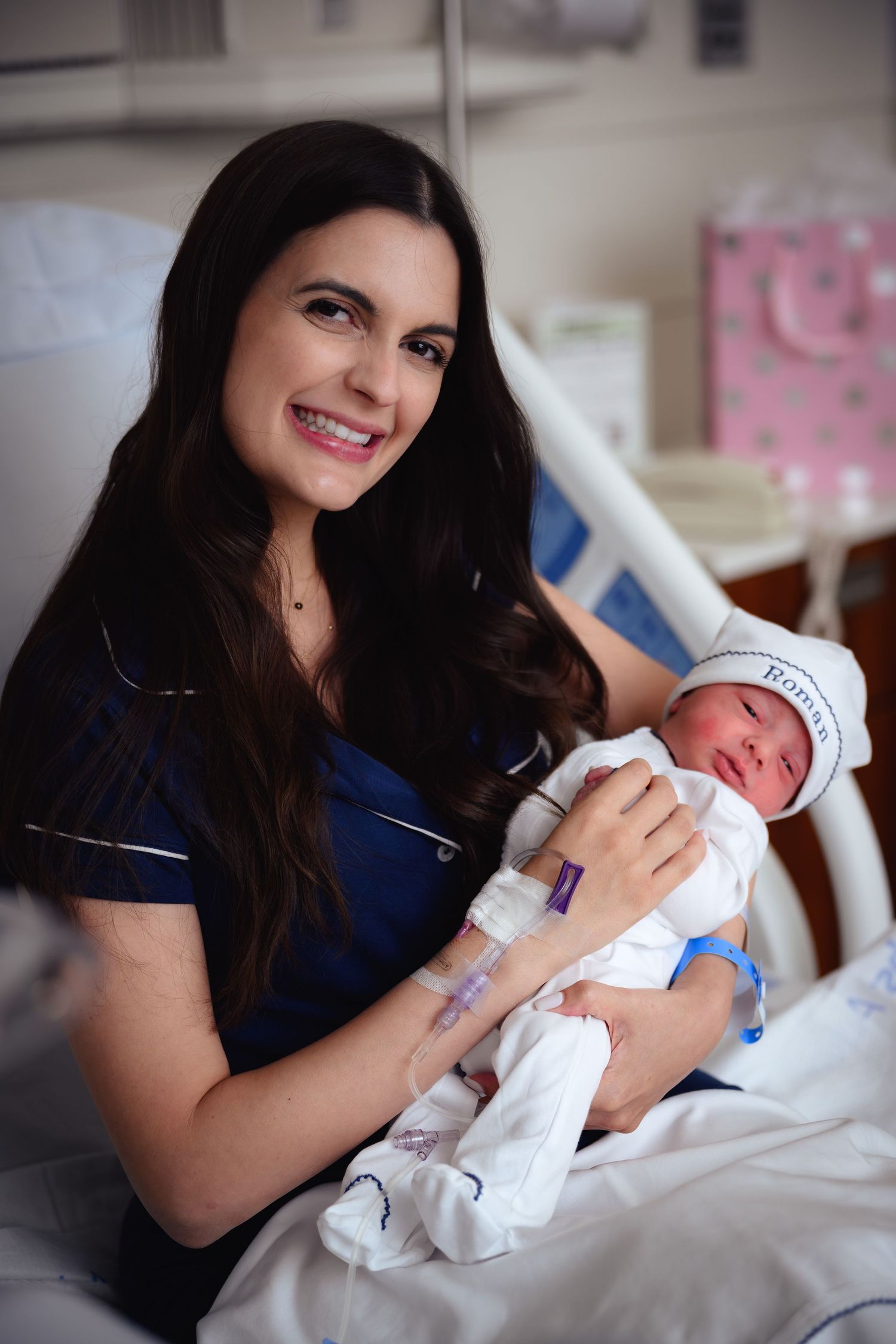 A series of tender moments showing a nurse in blue scrubs holding and feeding a newborn baby in a hospital setting.