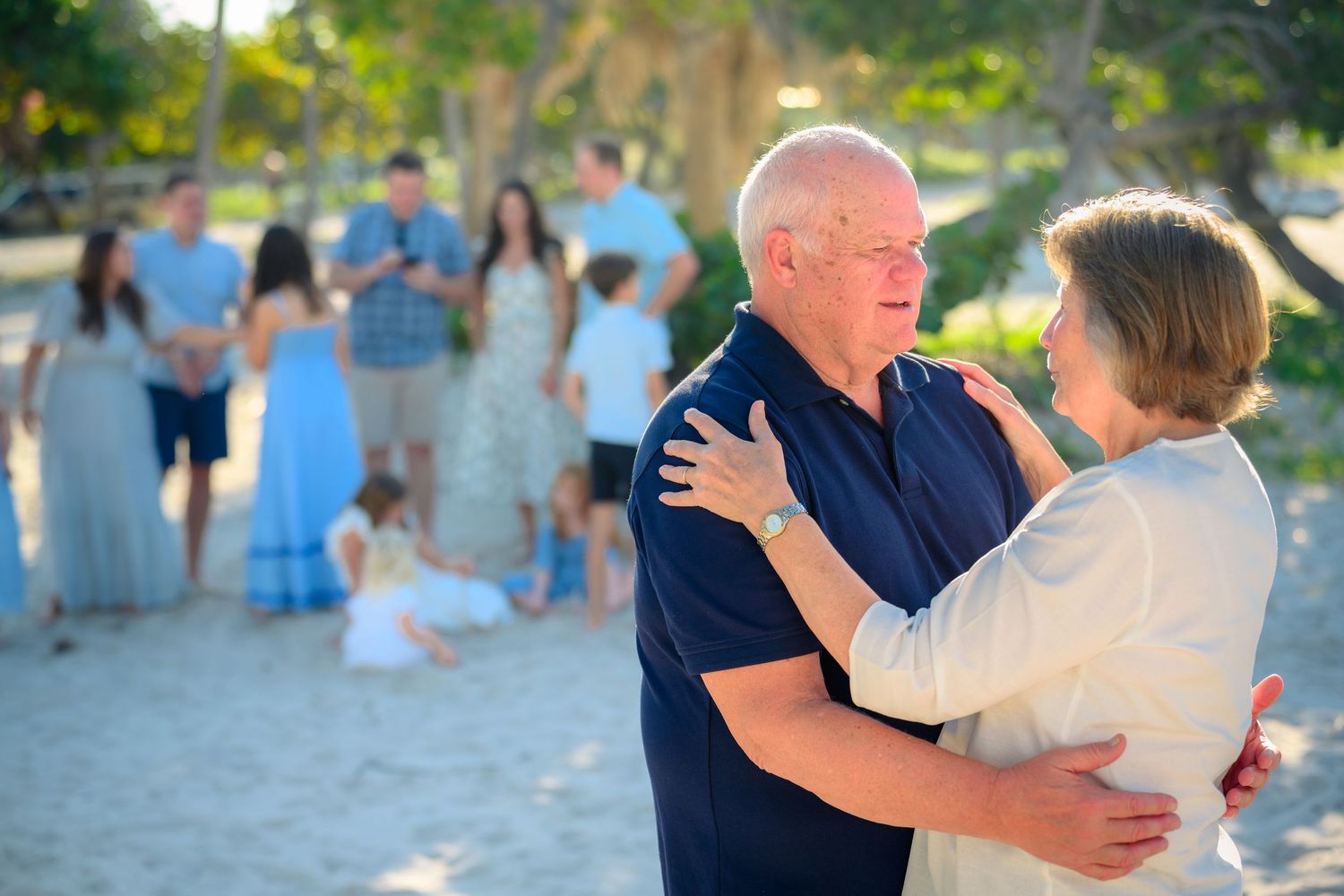 A series of wedding photos showing dancing and embracing couples at an outdoor celebration in natural lighting.