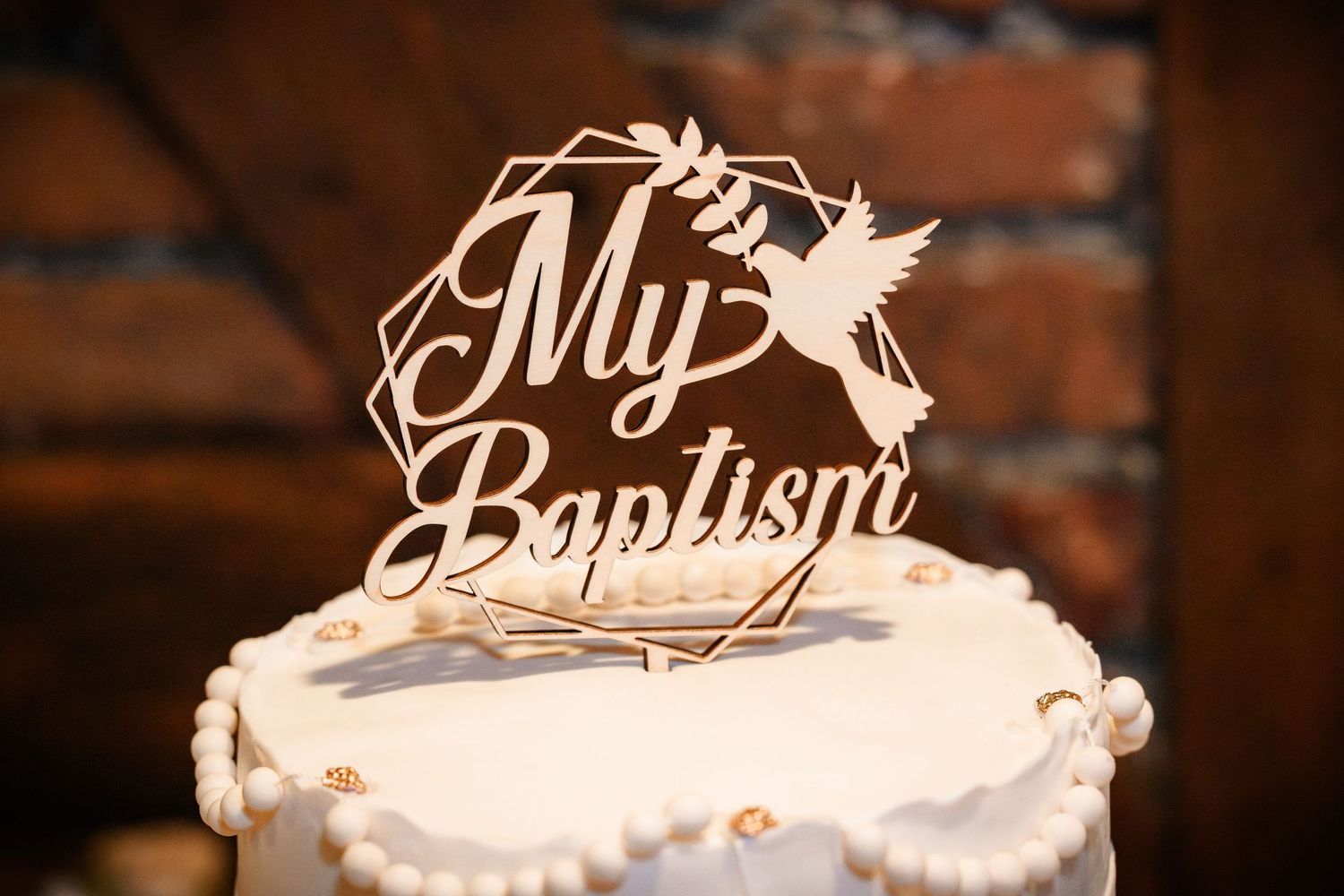 A cake topper from a Baptism lunch hosted at Casa Juancho in Pequeña Habana, Miami, FL.
