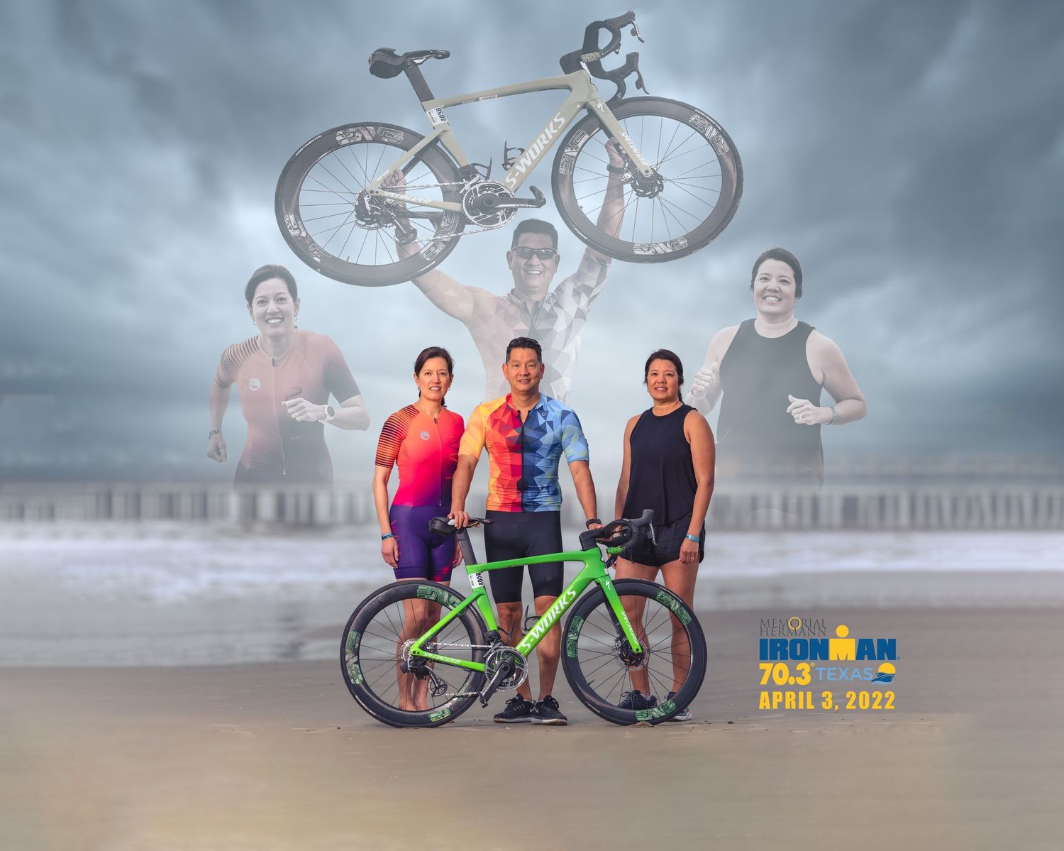 Three triathletes posing with a bike on a beach at an Ironman 70.3 event in 2022.