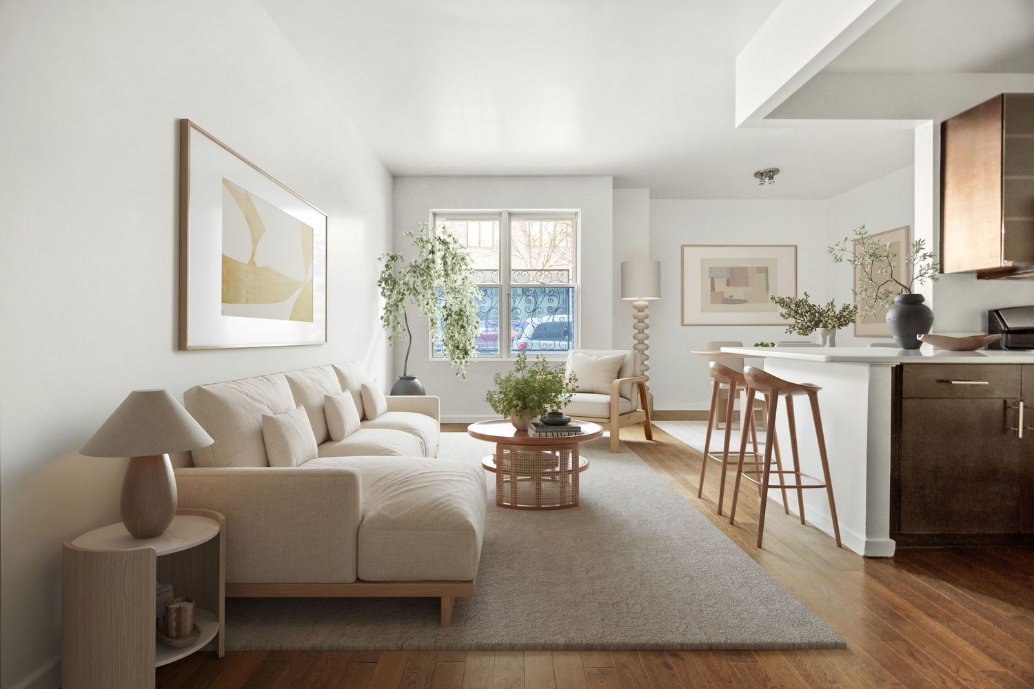 Bright modern living room with beige sofa, wood coffee table, indoor plants, bar stools, and hardwood floors.