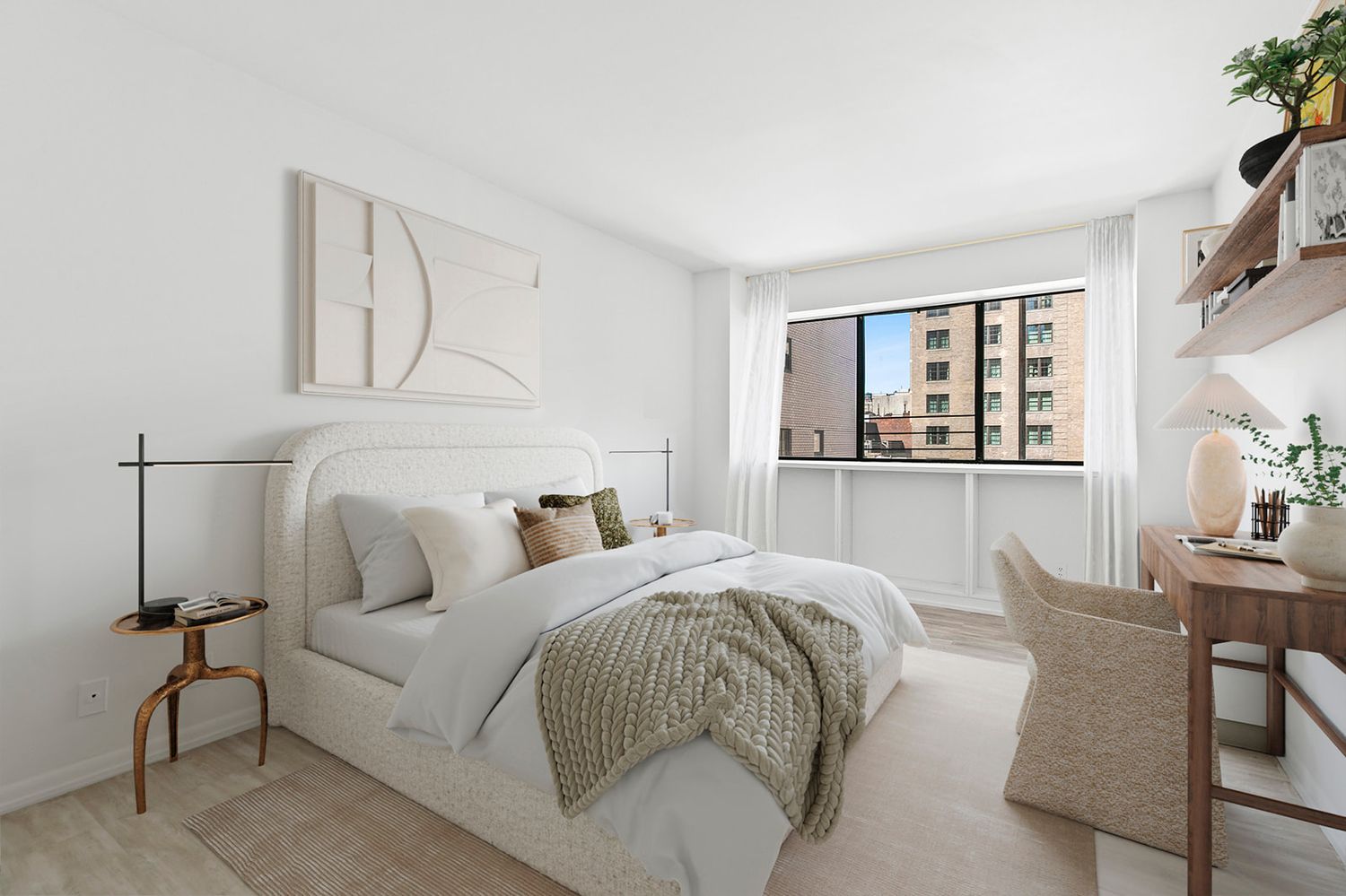 Bright modern bedroom with white walls, large window, neutral bedding, light wood floors, and a cozy wicker chair.