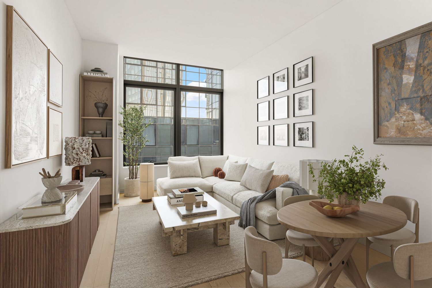 Modern living room with white sofa, marble coffee table, large windows, built-in shelving, and neutral tones throughout.
