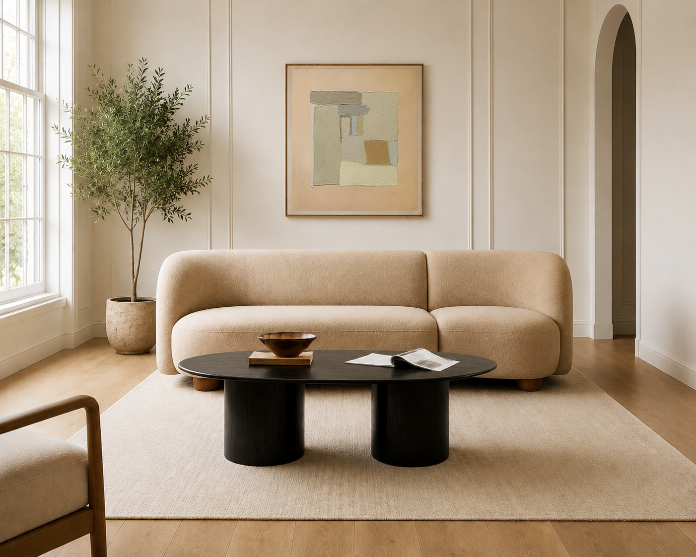 Modern living room with beige sofa and black coffee table.