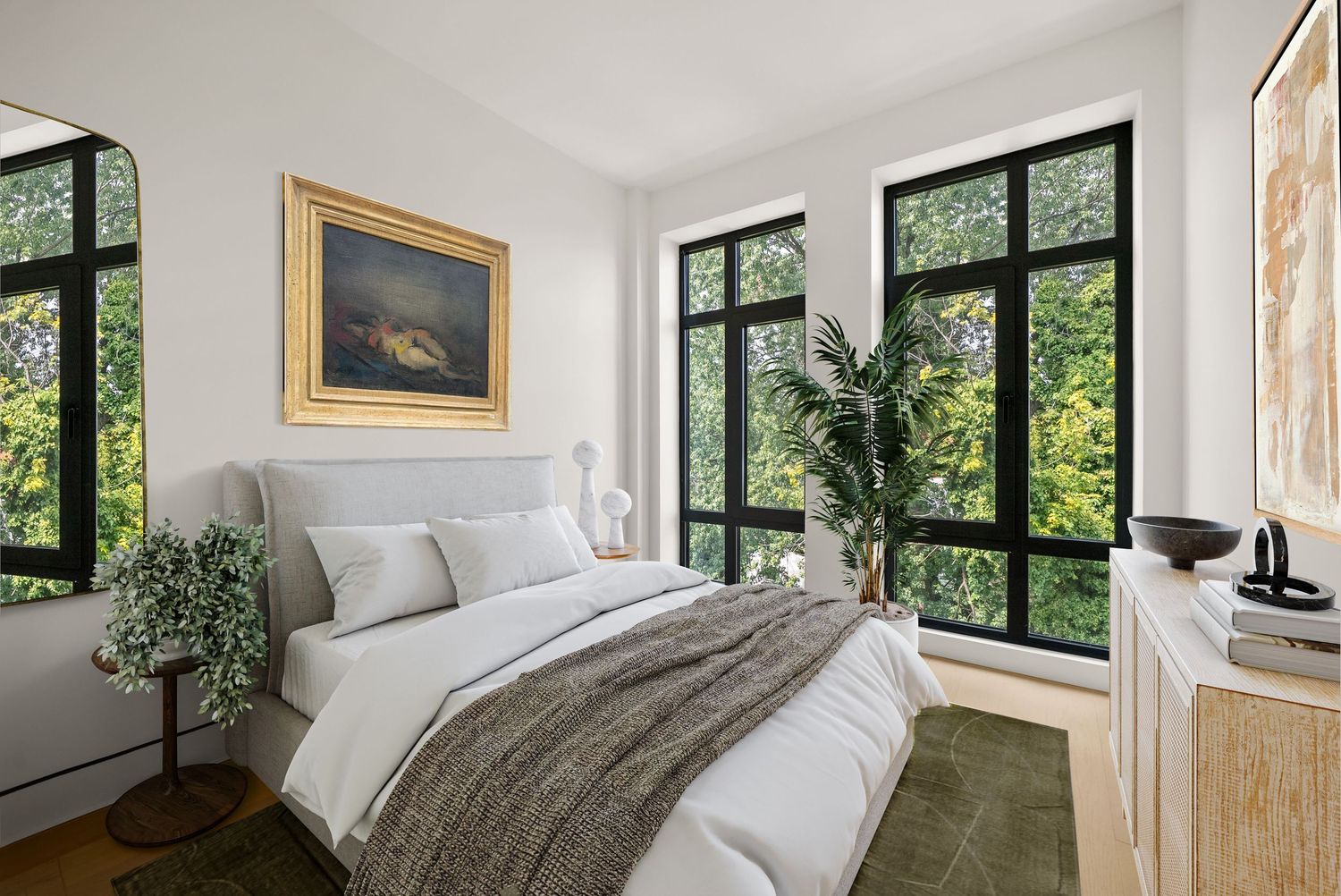 Bright bedroom with black-framed windows overlooking lush greenery, white bedding, gold-framed artwork, and natural wood accents.