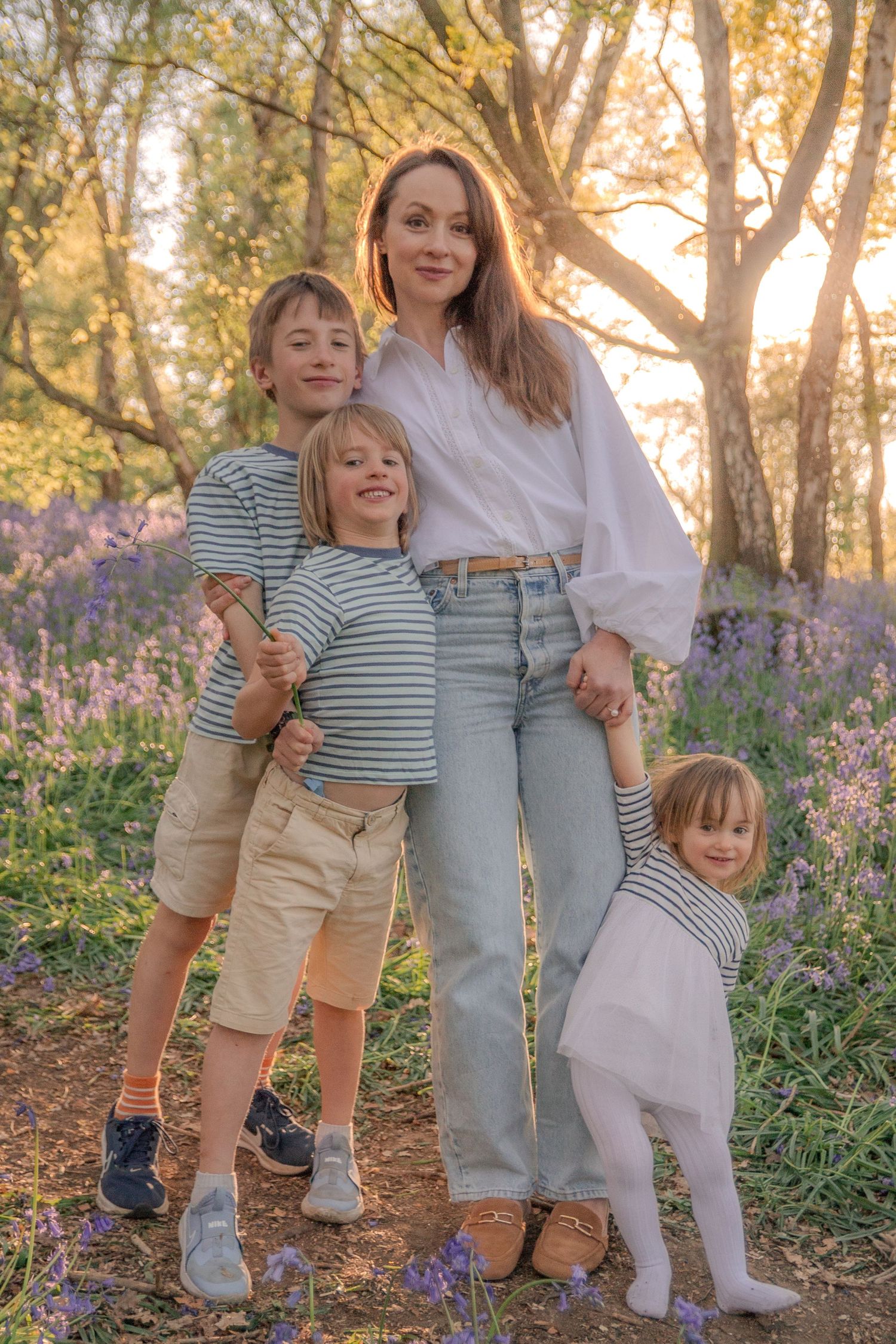 Mother and children at sunset.