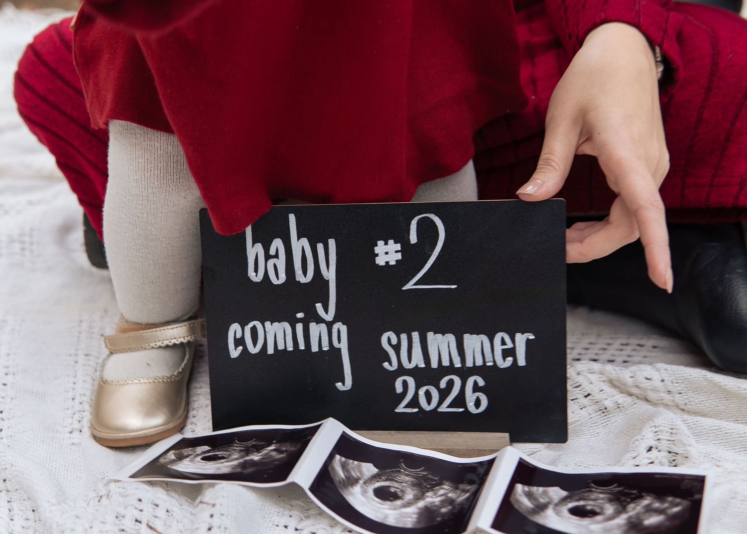 Baby number 2 coming summer 2026 chalkboard announcement with ultrasound photos.