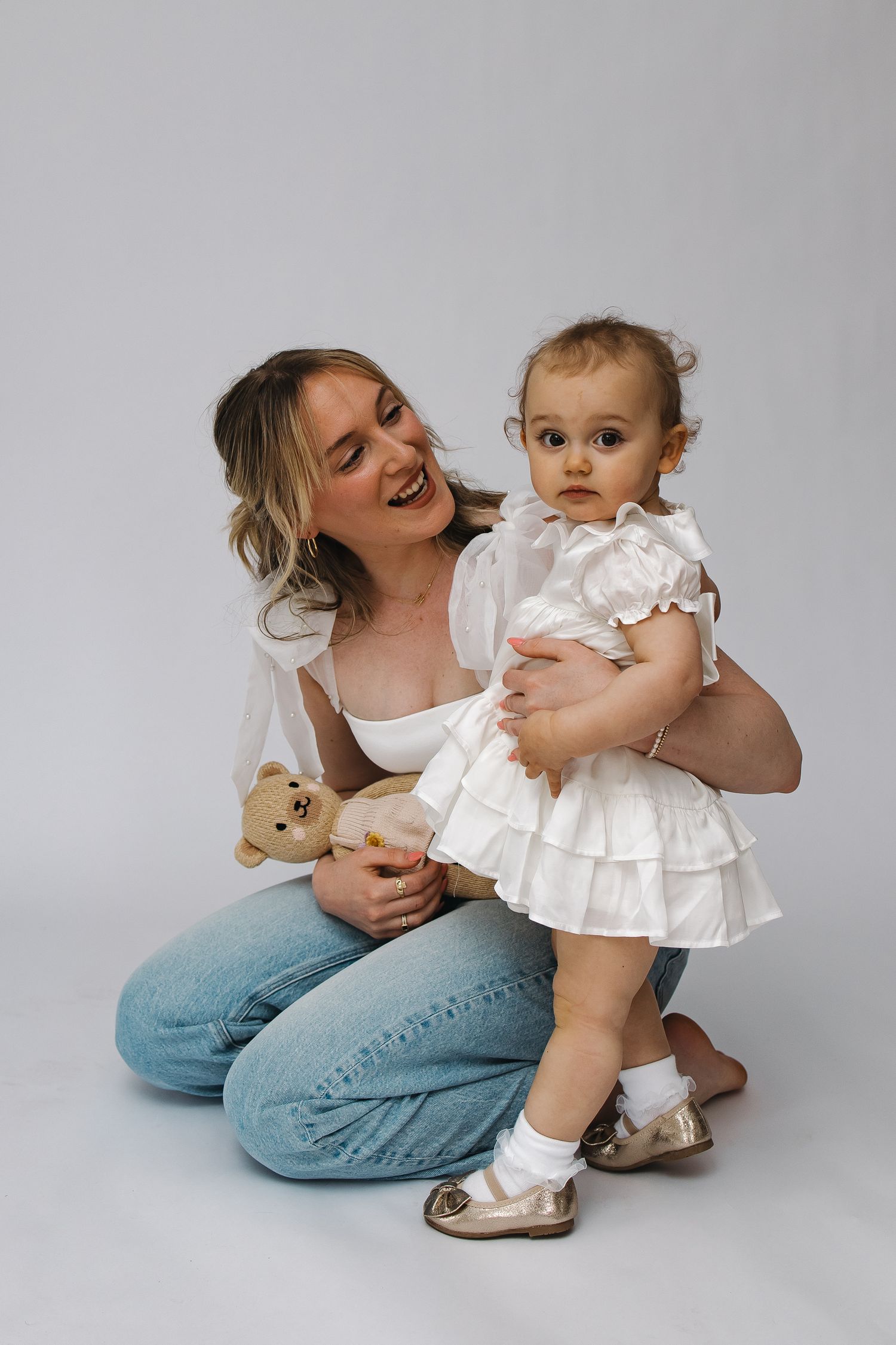 Mommy and Me in-studio session capturing special moments and bonding between mother and child with soft, timeless lighting