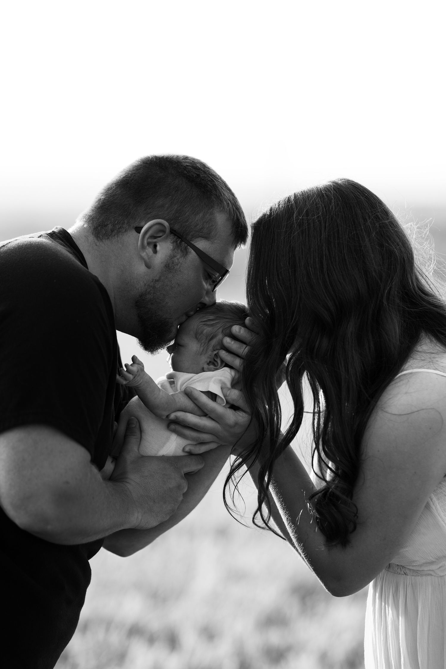 A romantic black and white photo sequence showing an intimate kiss.