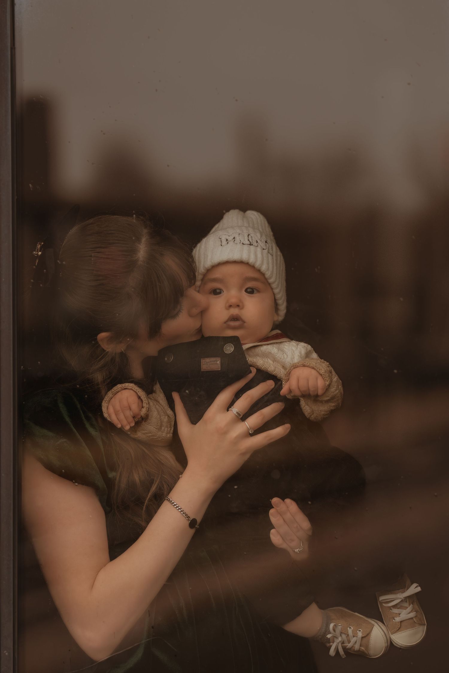 A series of intimate lifestyle portraits showing tender moments between a couple.