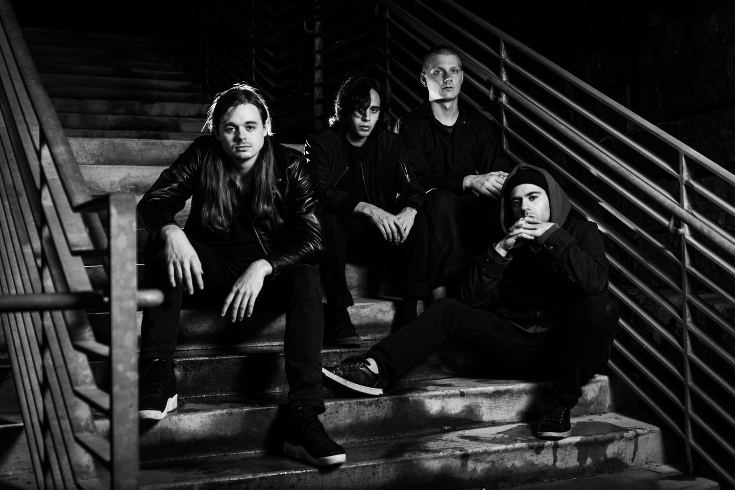 A black and white photo series showing people sitting on steps in various casual poses.
