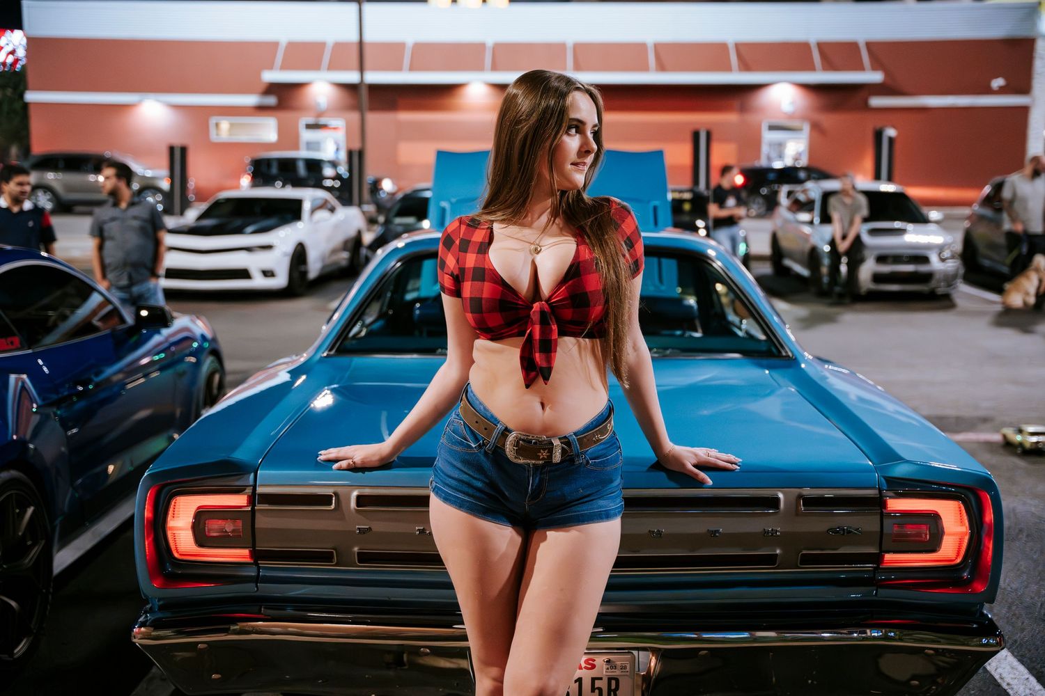 Retro-inspired fashion shoot with classic car and McDonald's backdrop at night.