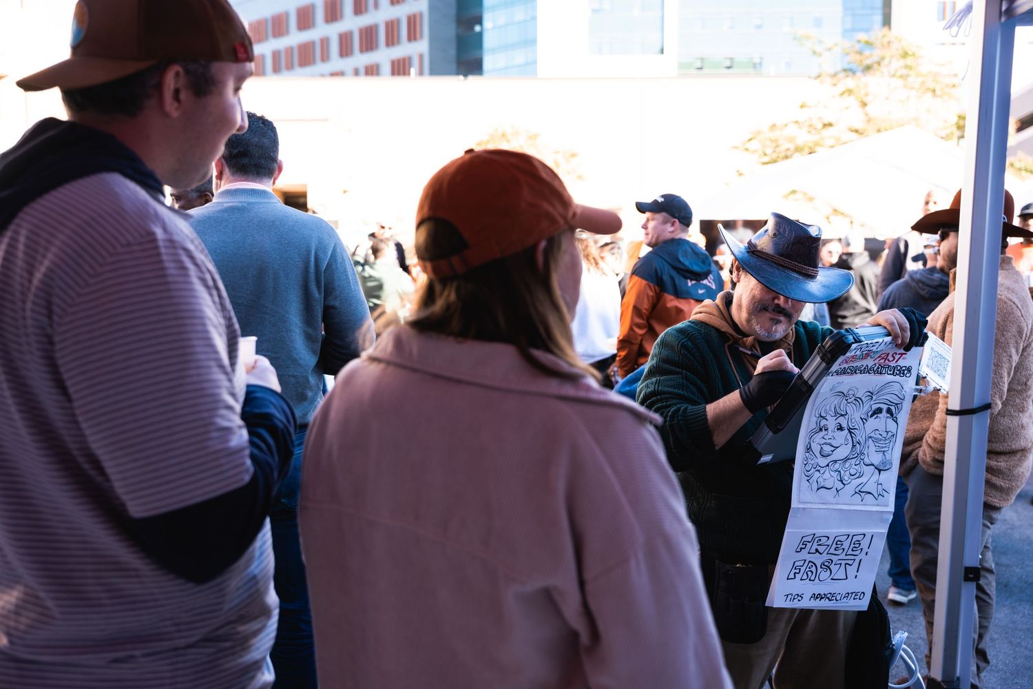 Crowd of people wearing casual attire gathered at an outdoor event.