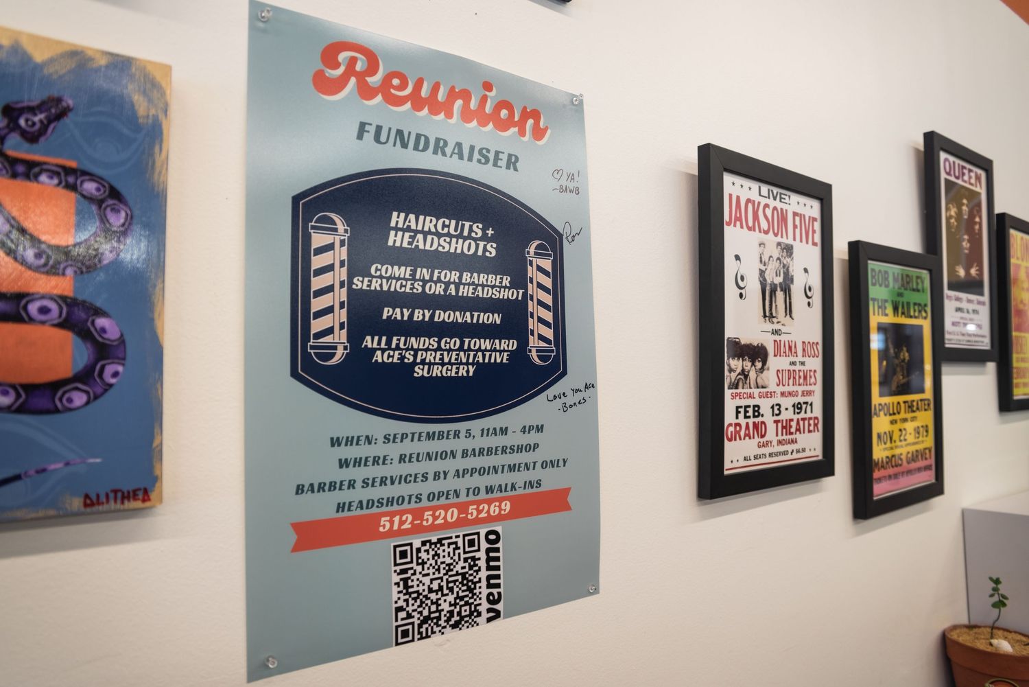 Wall display of vintage-style posters and signs in a barbershop.