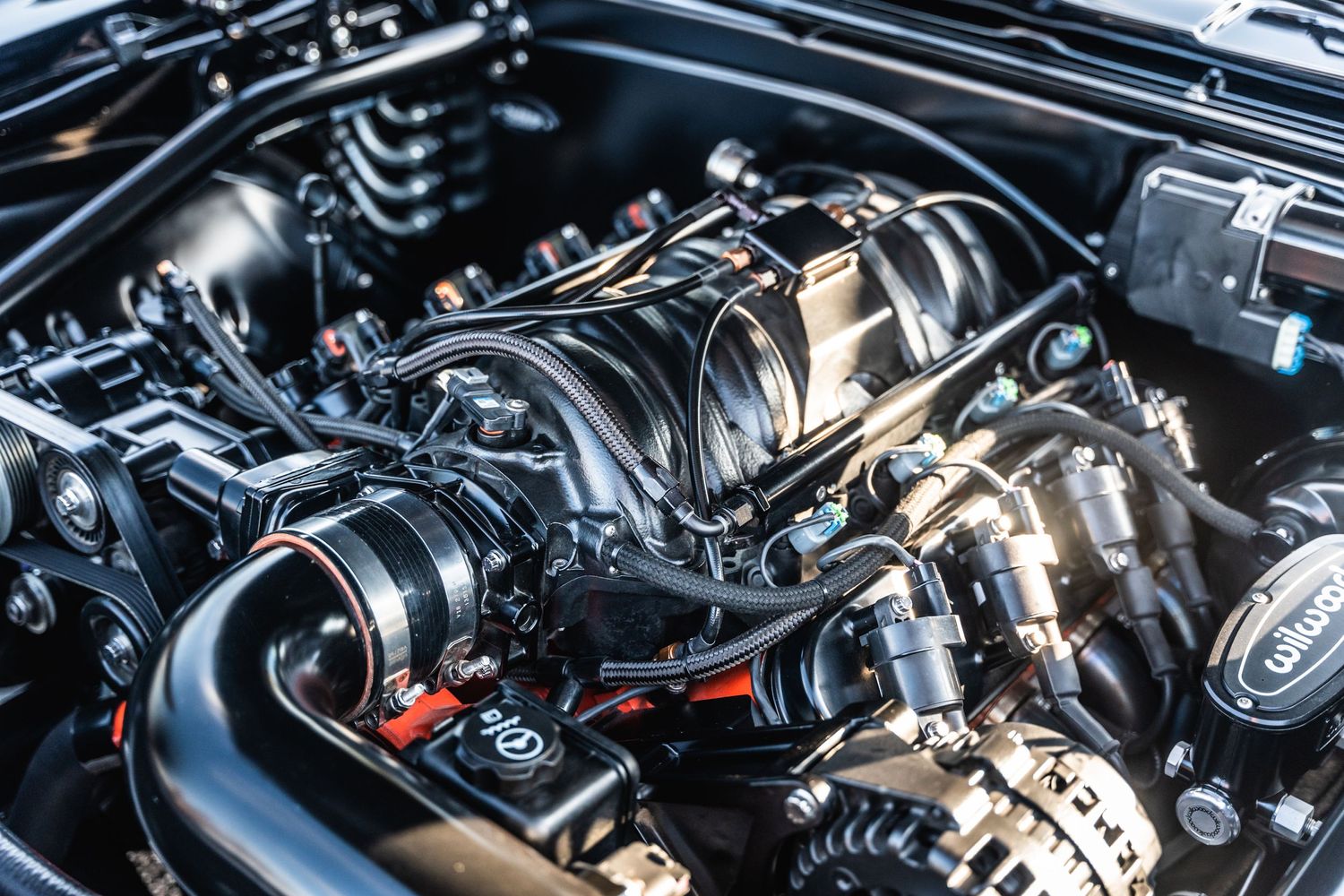 Clean modern car engine compartment showing detailed mechanical components.