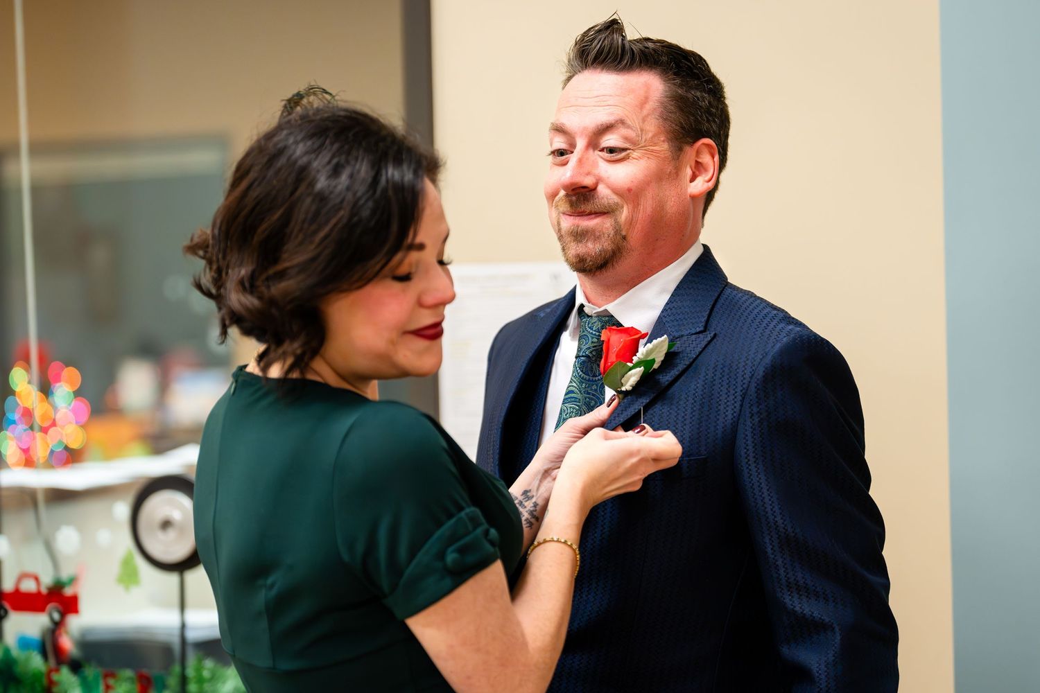 Couple in formal attire share intimate moment during wedding celebration.