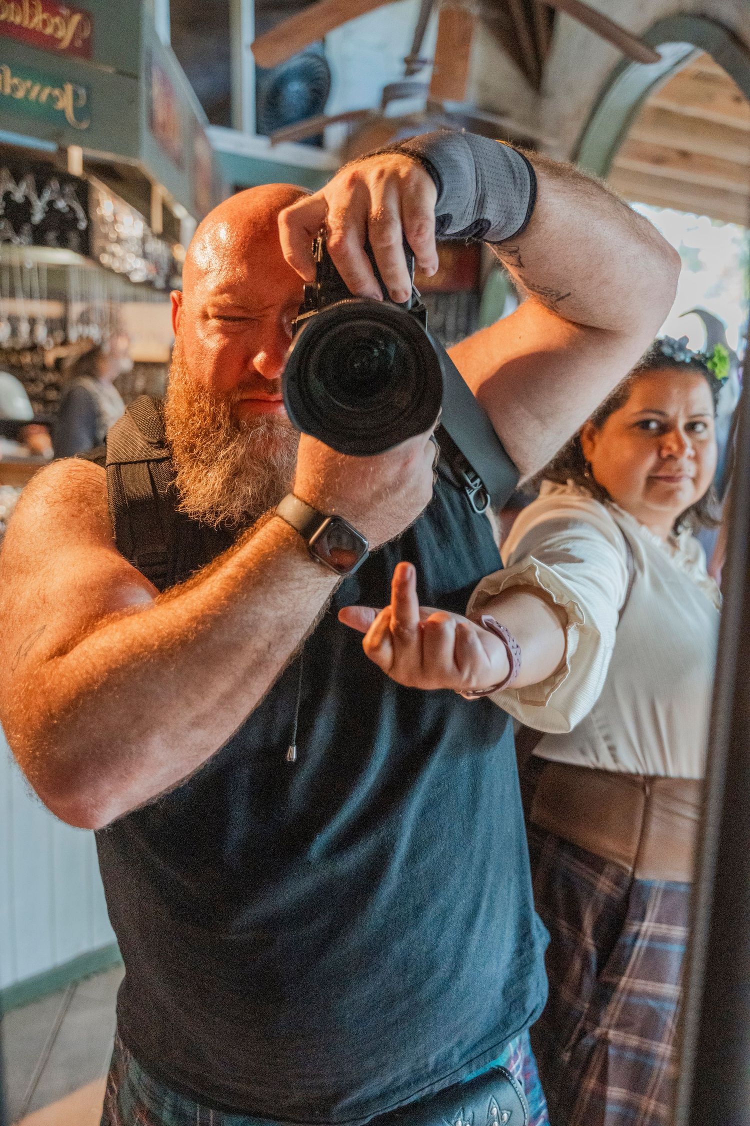 A photographer taking pictures at a renaissance festival.