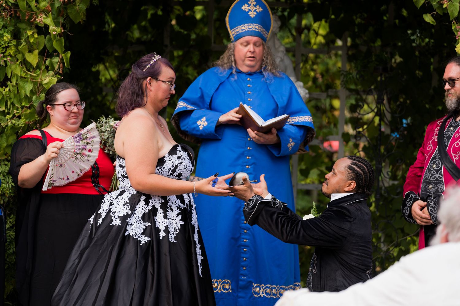 Couples dancing together outdoors during a summer dance event in a park setting.
