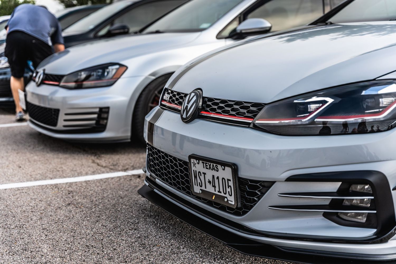 Close-up of Volkswagen GTI front grilles with distinctive red accent stripe.