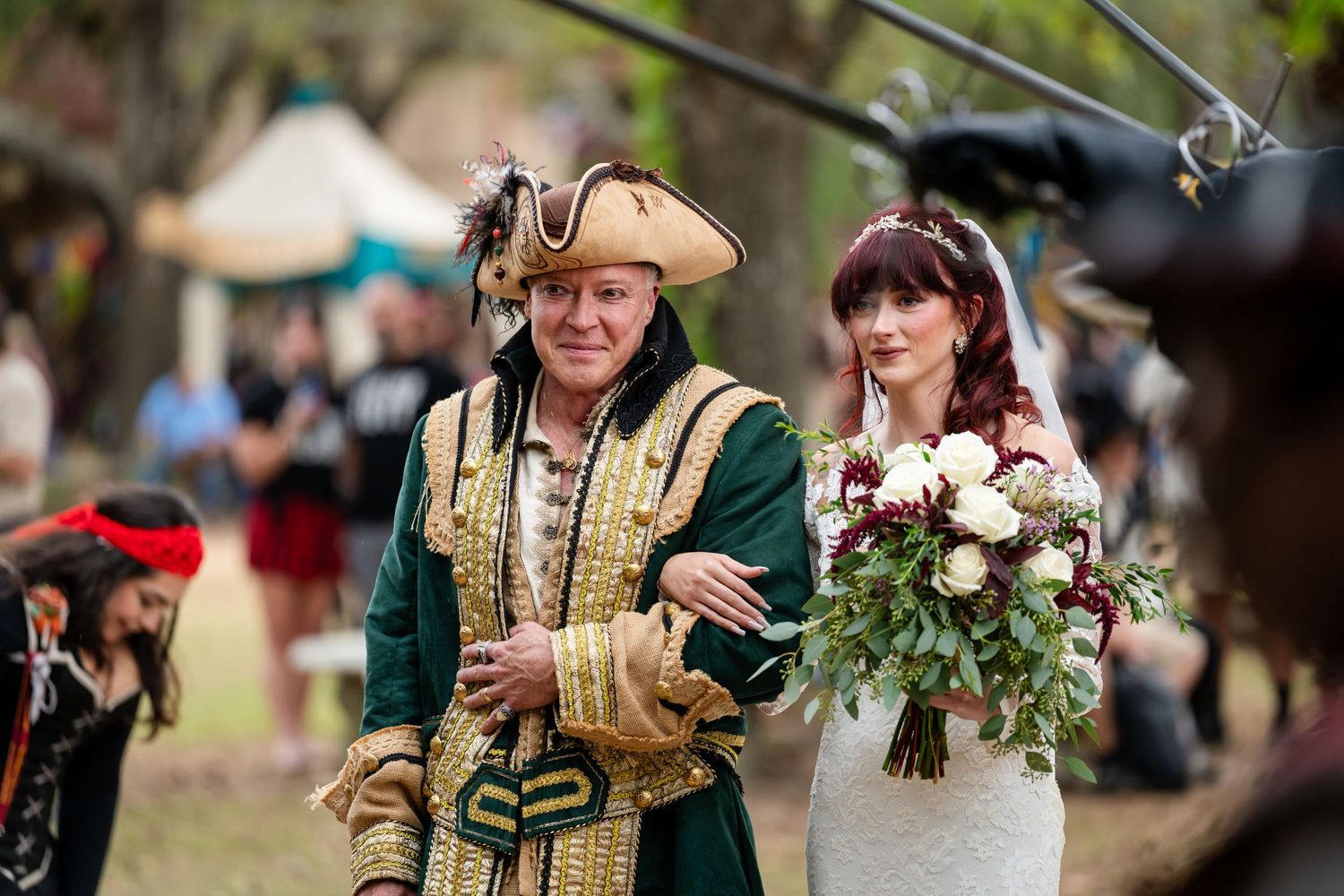 Medieval performers in period costumes entertain crowds at a Renaissance festival with music and dance.