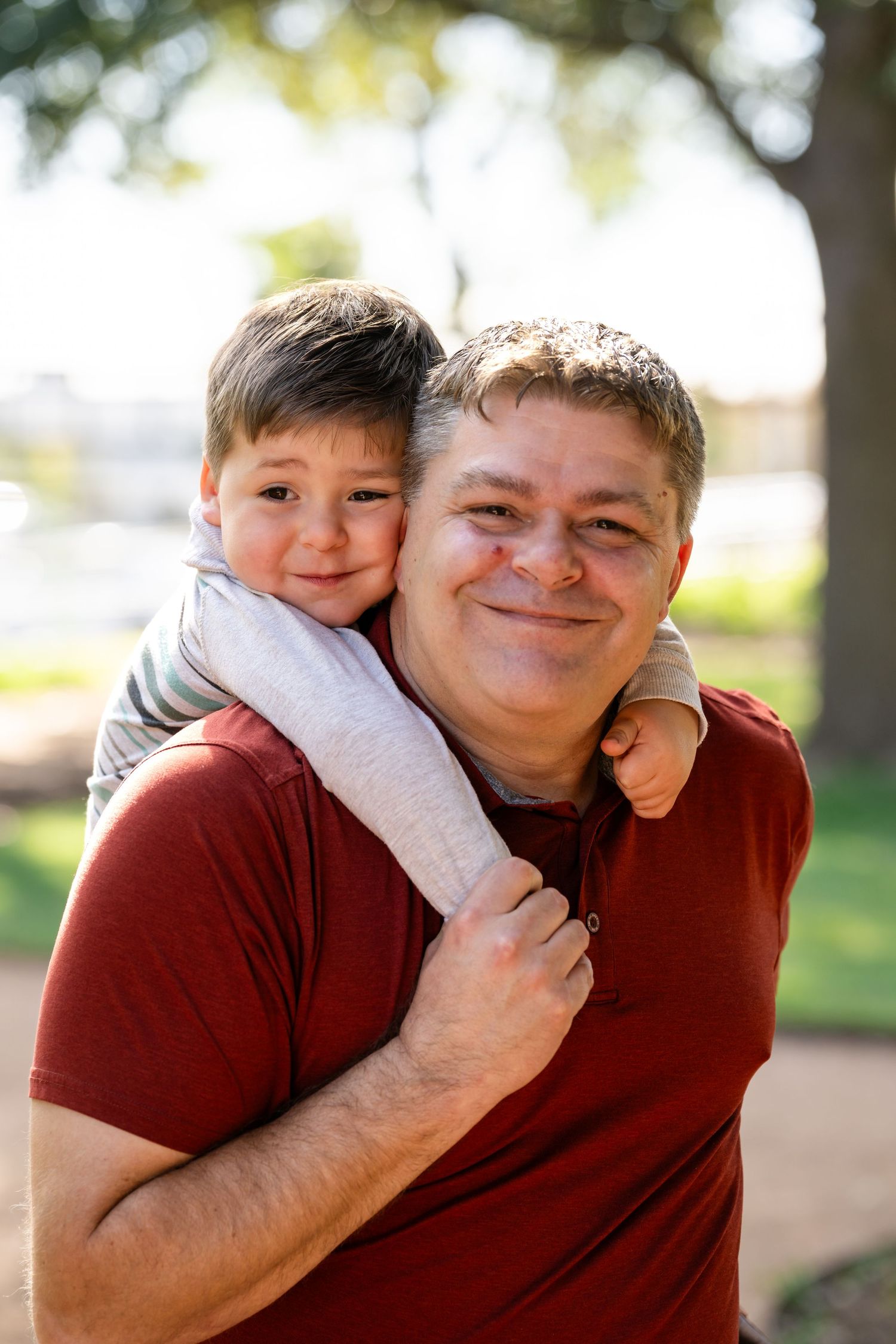 Three heartwarming candid moments showing a warm embrace in an outdoor setting with natural bokeh lighting effects.