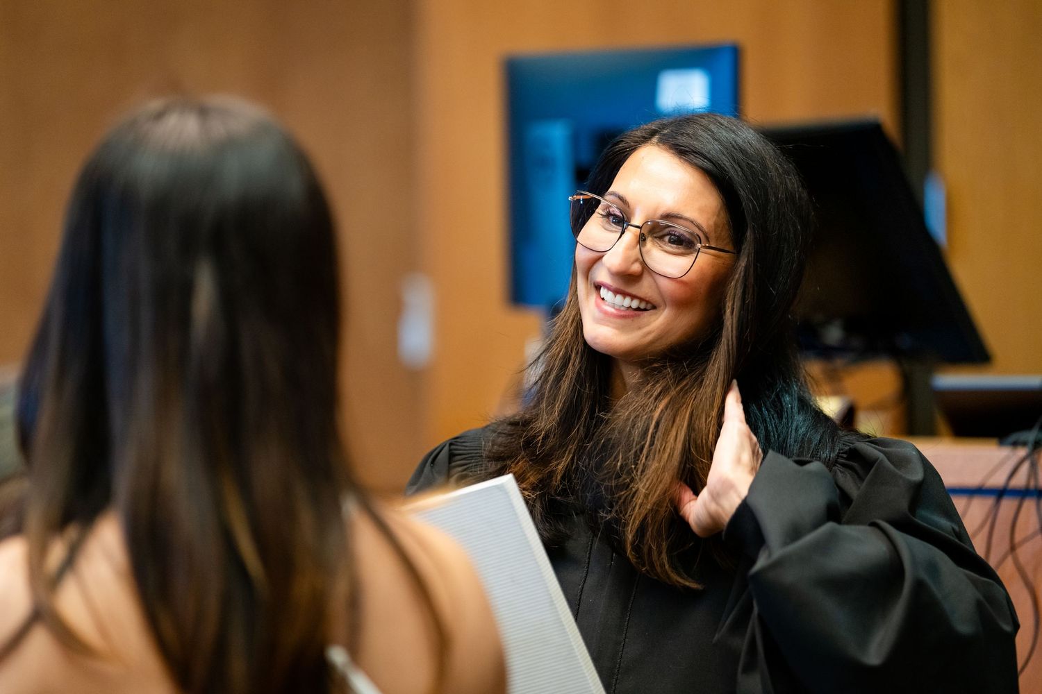 Students engage in lively discussion during a classroom seminar at a university.