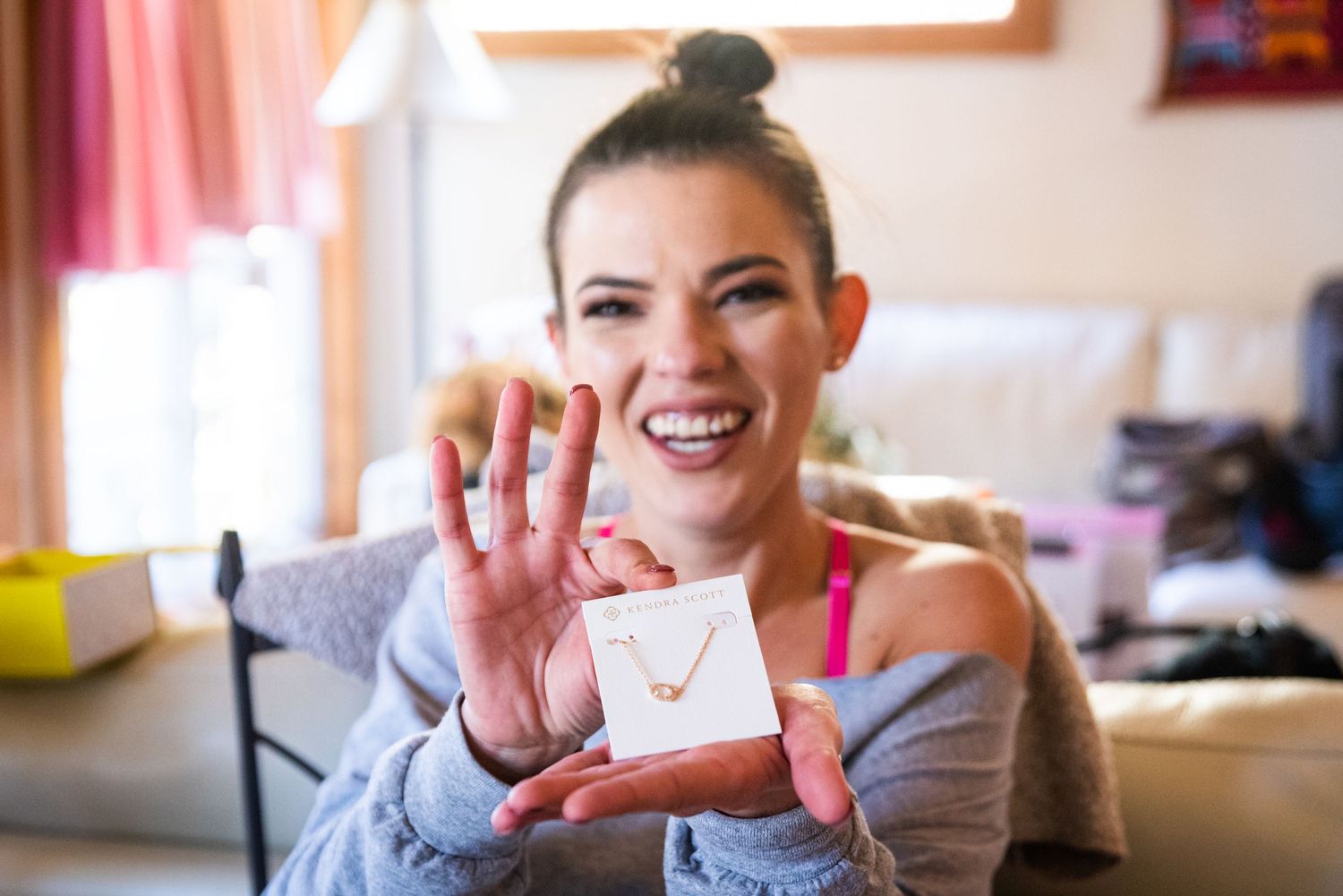 A candid moment showing someone holding a small jewelry box.